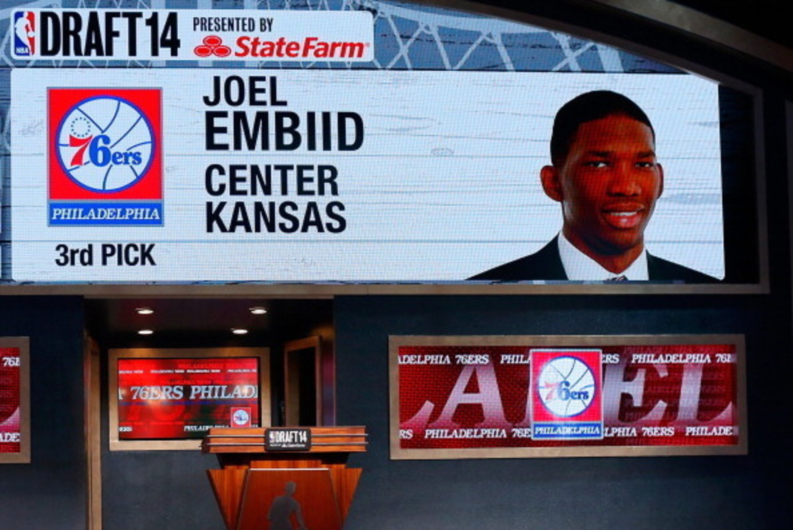 NEW YORK, NY - JUNE 26: A video screen shows the selection of Joel Embiid of Kansas as the #3 overall pick in the first round by the Philadelphia 76ers during the 2014 NBA Draft at Barclays Center on June 26, 2014 in the Brooklyn borough of New York City NEW YORK, NY - JUNE 26: A video screen shows the selection of Joel Embiid of Kansas as the #3 overall pick in the first round by the Philadelphia 76ers during the 2014 NBA Draft at Barclays Center on June 26, 2014 in the Brooklyn borough of New York City