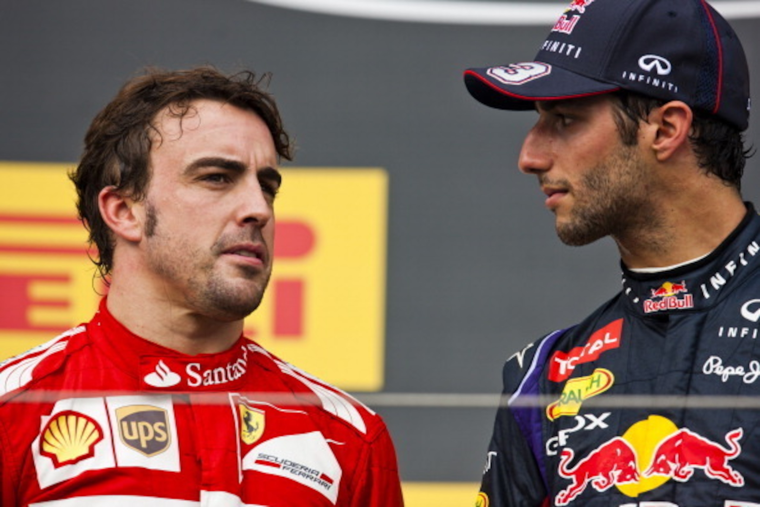 BUDAPEST, HUNGARY - JULY 27:  Daniel Ricciardo of Australia and Infiniti Red Bull Racing speaks with Fernando Alonso of Spain and Ferrari as he celebrates victory on the podium after the Hungarian Formula One Grand Prix at Hungaroring on July 27, 2014 in