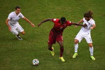 MANAUS, BRAZIL - JUNE 22:  William Carvalho of Portugal takes on Graham Zusi and Kyle Beckerman of the United States during the 2014 FIFA World Cup Brazil Group G match between the United States and Portugal at Arena Amazonia on June 22, 2014 in Manaus, B