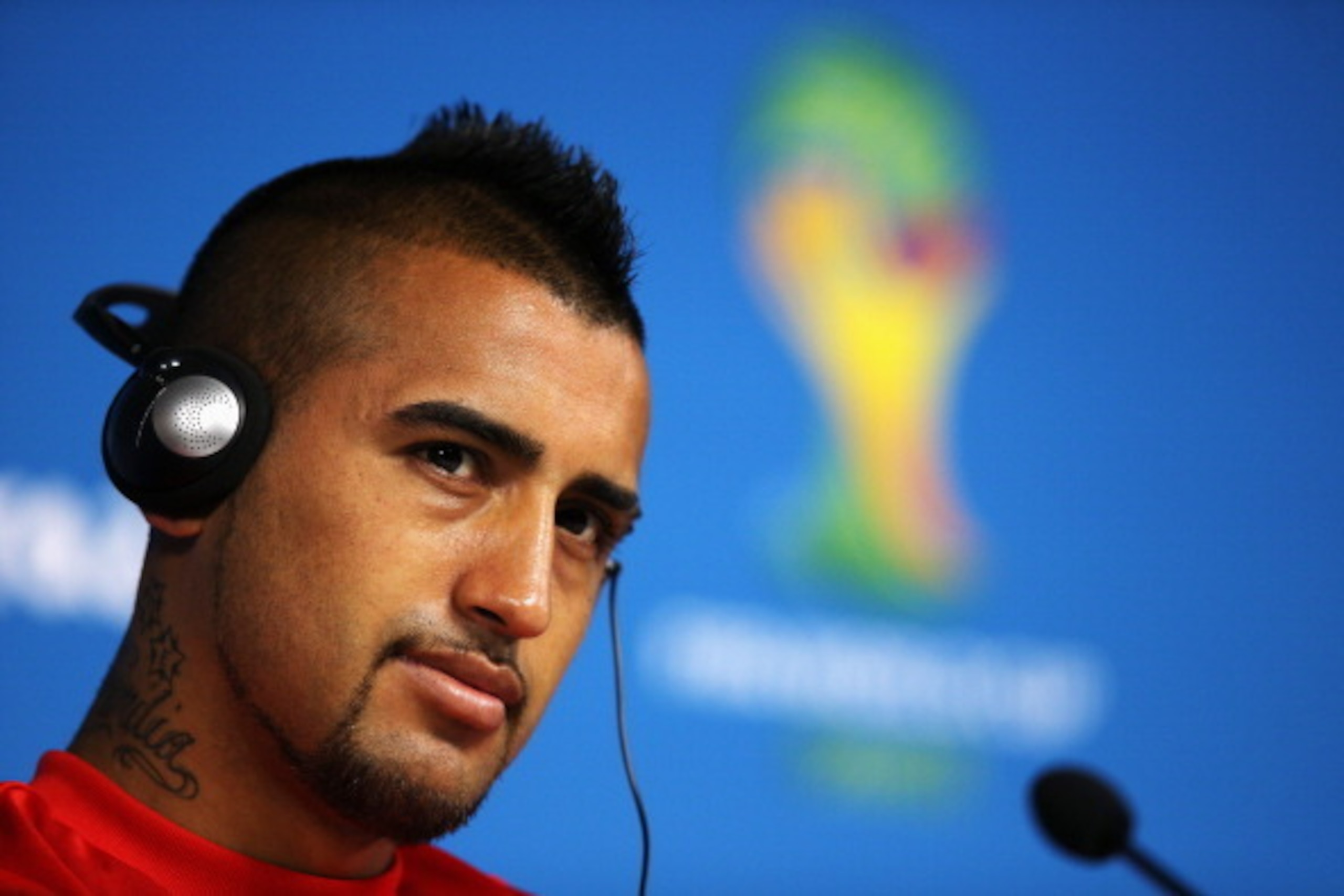SAO PAULO, BRAZIL - JUNE 22:  Arturo Vidal listens to a question during the Chile Press Conference at the 2014 FIFA World Cup Brazil held at the Arena de Sao Paulo on June 22, 2014 in Sao Paulo, Brazil.  (Photo by Dean Mouhtaropoulos/Getty Images)