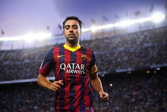 BARCELONA, SPAIN - SEPTEMBER 14:  Xavi Hernandez of FC Barcelona looks on  during the La Liga match between FC Barcelona and Sevilla FC at Camp Nou on September 14, 2013 in Barcelona, Spain.  (Photo by David Ramos/Getty Images)