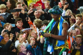 GLASGOW, SCOTLAND - AUGUST 02:  Usain Bolt of Jamaica greets fans as he celebrates winning gold in the MenÂs 4x100 metres relay final at Hampden Park during day ten of the Glasgow 2014 Commonwealth Games on August 2, 2014 in Glasgow, United Kingdom.  (Pho