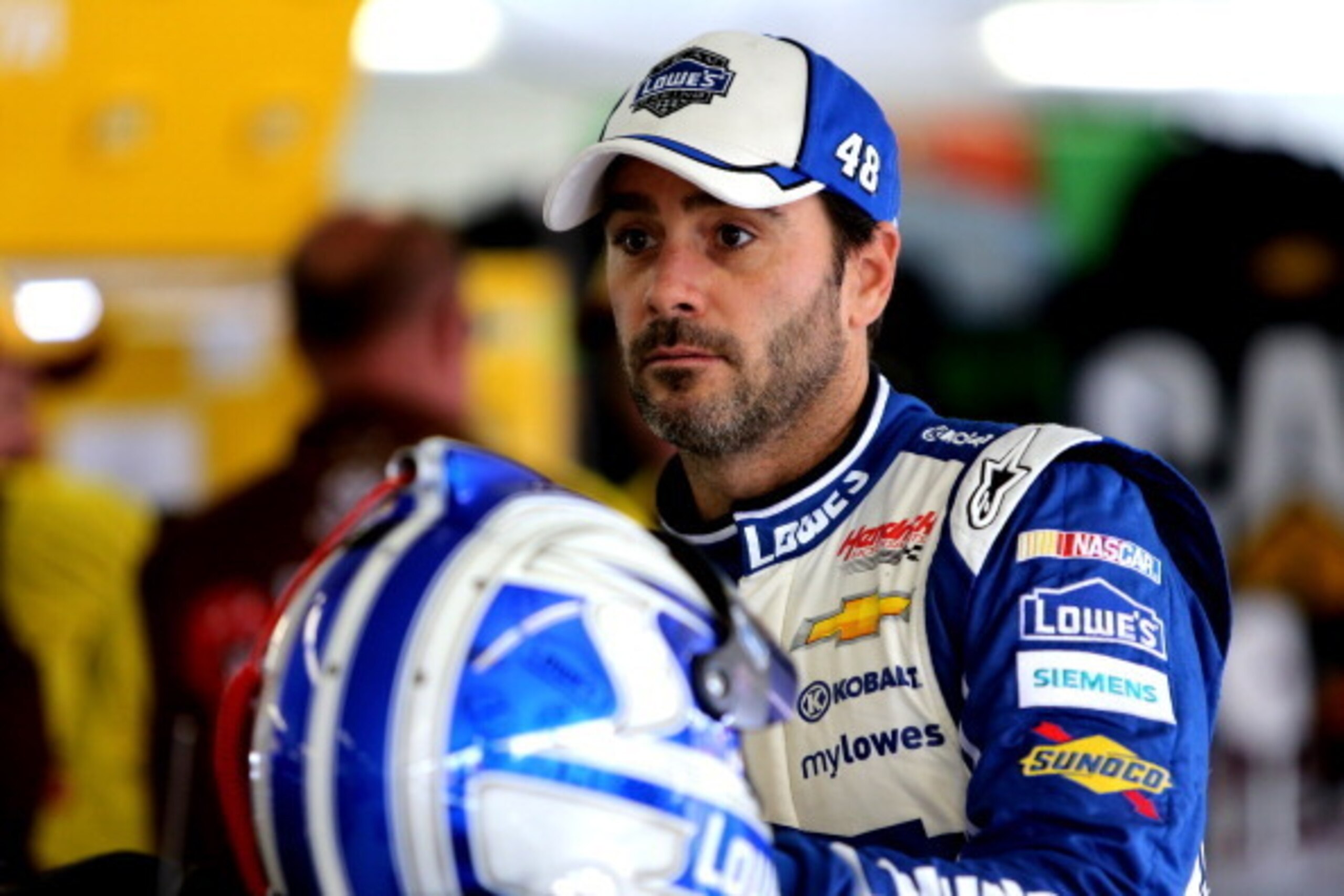 LONG POND, PA - AUGUST 02:  Jimmie Johnson, driver of the #48 Lowe's Chevrolet, stands in the garage during practice for the NASCAR Sprint Cup Series GoBowling.com 400 at Pocono Raceway on August 2, 2014 in Long Pond, Pennsylvania.  (Photo by Jerry Markla