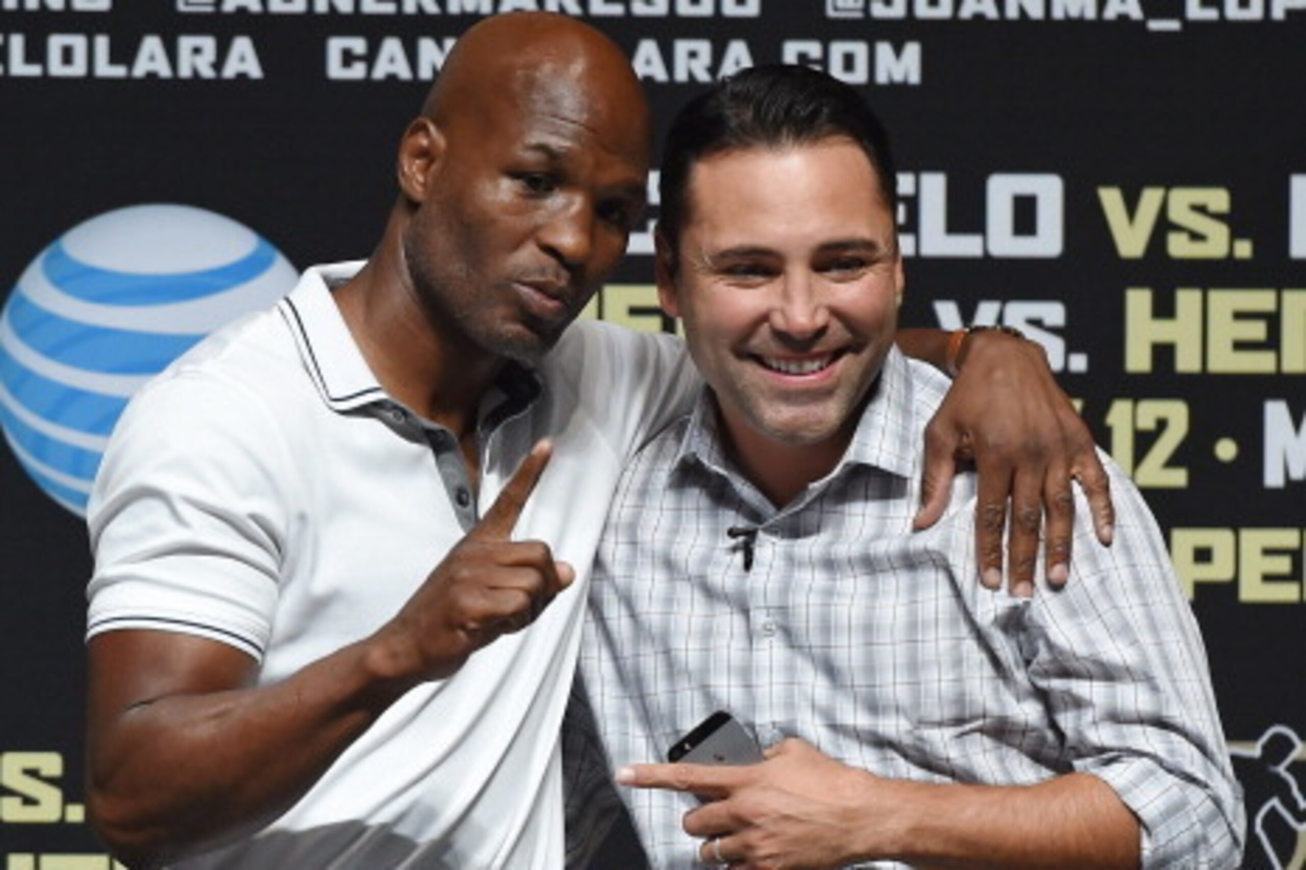 LAS VEGAS, NV - JULY 11:  Boxer Bernard Hopkins (L) and President of Golden Boy Promotions Oscar De La Hoya pose as they are introduced at the official weigh-in for Canelo Alvarez and Erislandy Lara at the MGM Grand Garden Arena on July 11, 2014 in Las Ve