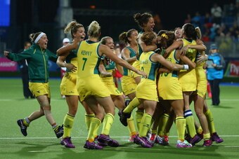 GLASGOW, SCOTLAND - AUGUST 02:  Australia players celebrate winning the gold medal after the Women's Gold Medal Match against England at Glasgow National Hockey Centre during day ten of the Glasgow 2014 Commonwealth Games on August 2, 2014 in Glasgow, Sco
