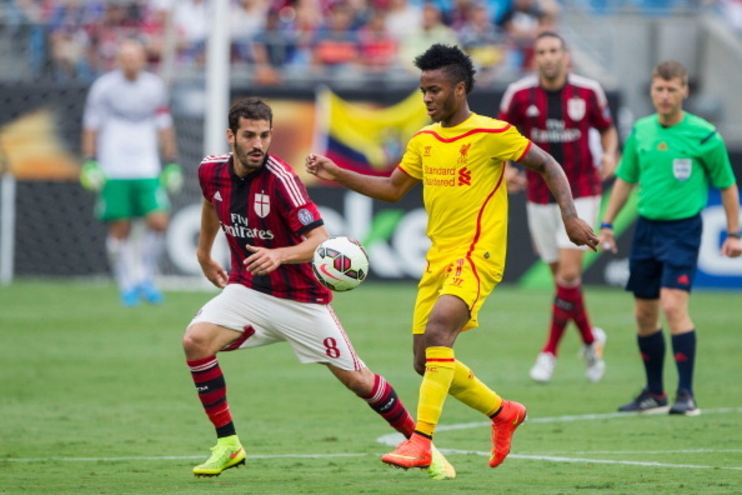 CHARLOTTE, NC - AUGUST 02: Raheem Sterling #31 of Liverpool controls the ball in front of Riccardo Saponara #8 of A.C. Milan during first half action in the Guinness International Champions Cup at Bank of America Stadium on August 2, 2014 in Charlotte, No