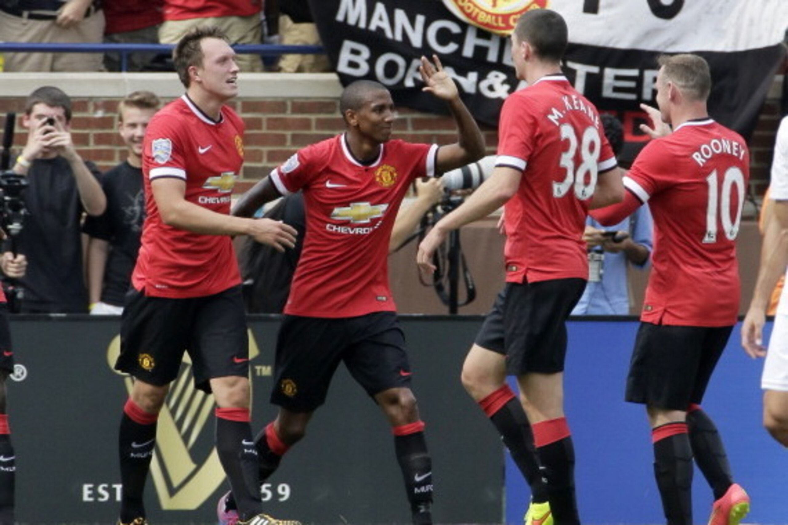 ANN ARBOR, MI - AUGUST 2: Ashley Young #18 of Manchester United celebrates his first half goal against Real Madrid with Michael Keane #38, Wayne Rooney #10 and Phil Jones #4, left, during the Guinness International Champions Cup at Michigan Stadium on Au ANN ARBOR, MI - AUGUST 2: Ashley Young #18 of Manchester United celebrates his first half goal against Real Madrid with Michael Keane #38, Wayne Rooney #10 and Phil Jones #4, left, during the Guinness International Champions Cup at Michigan Stadium on Au