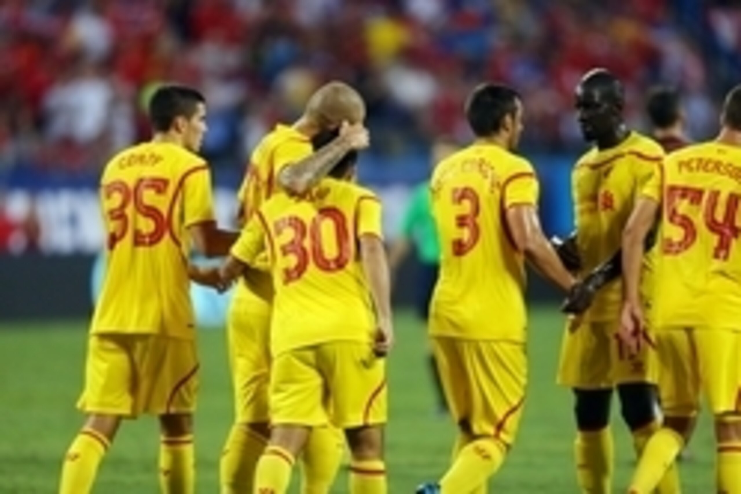 Aug 2, 2014; Charlotte, NC, USA; Liverpool midfielder Suso (30) celebrates with teammates after a goal against AC Milan in a friendly at Bank of America Stadium. Mandatory Credit: Jim Dedmon-USA TODAY Sports Aug 2, 2014; Charlotte, NC, USA; Liverpool midfielder Suso (30) celebrates with teammates after a goal against AC Milan in a friendly at Bank of America Stadium. Mandatory Credit: Jim Dedmon-USA TODAY Sports