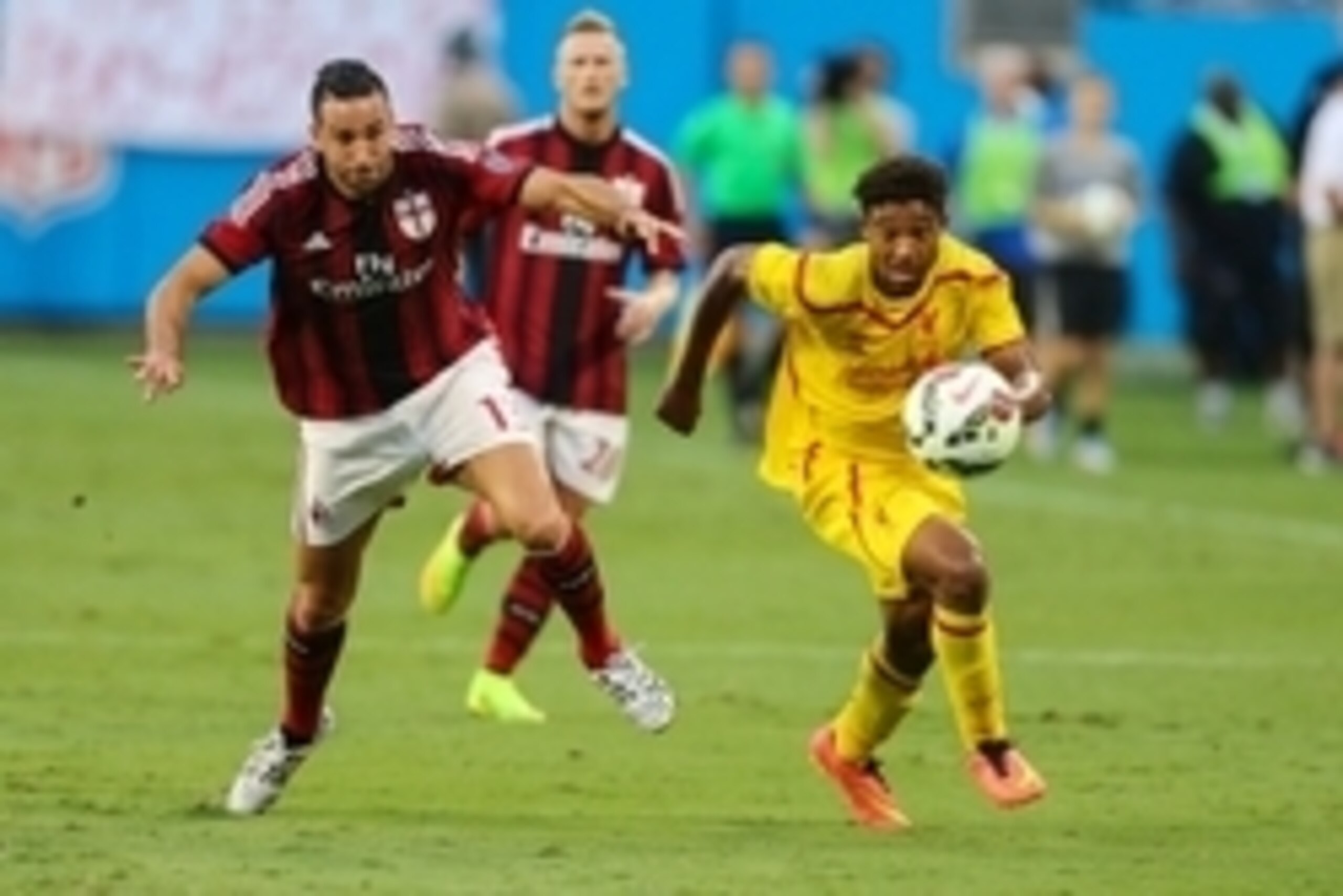 Aug 2, 2014; Charlotte, NC, USA; AC Milan midfielder Rami Adil (13) and Liverpool forward Jordon Ibe (33) race to the ball during an international friendly at Bank of America Stadium. Mandatory Credit: Jim Dedmon-USA TODAY Sports Aug 2, 2014; Charlotte, NC, USA; AC Milan midfielder Rami Adil (13) and Liverpool forward Jordon Ibe (33) race to the ball during an international friendly at Bank of America Stadium. Mandatory Credit: Jim Dedmon-USA TODAY Sports
