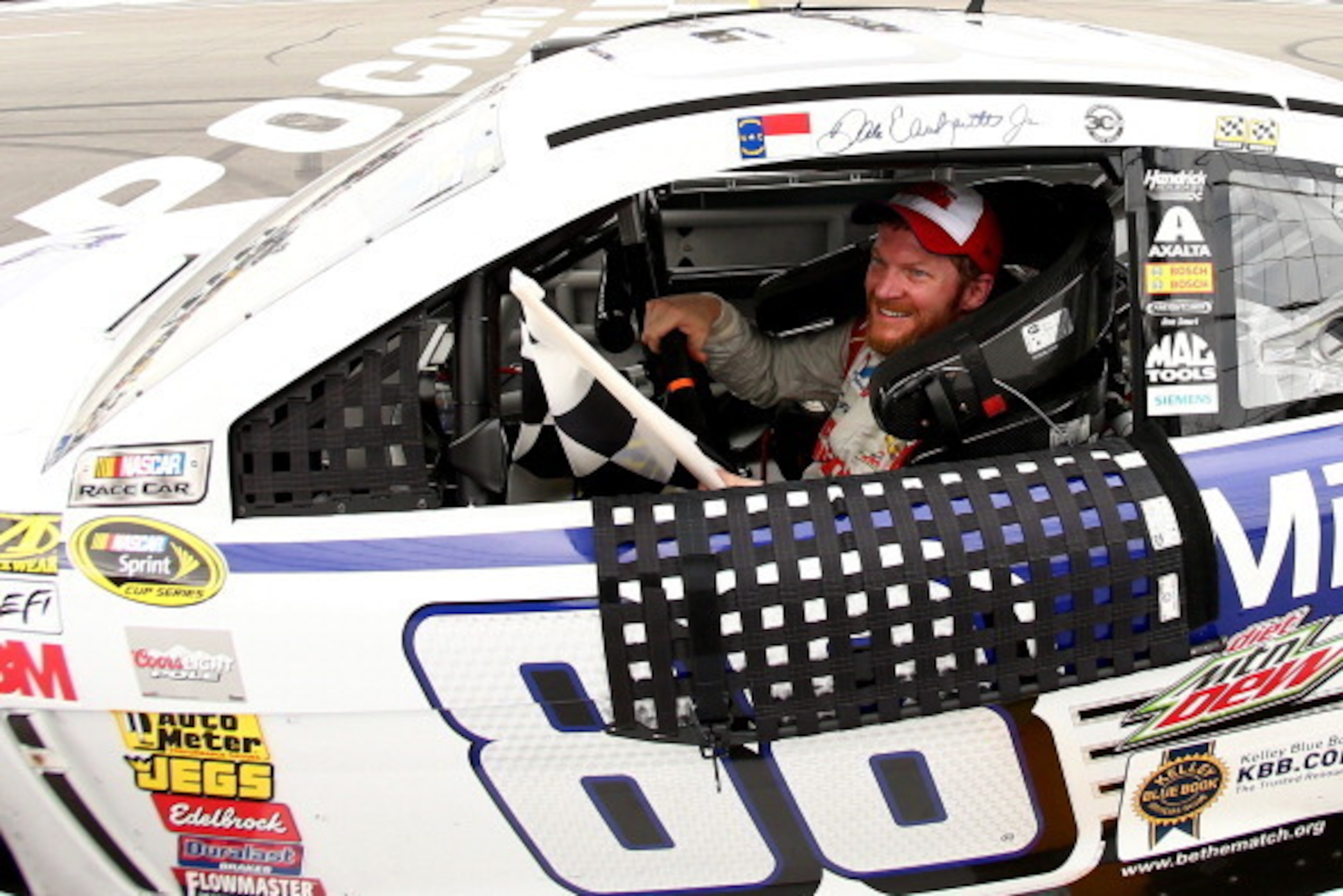 LONG POND, PA - AUGUST 03:  Dale Earnhardt Jr., driver of the #88 Michael Baker International Chevrolet, celebrates after winning the NASCAR Sprint Cup Series GoBowling.com 400 at Pocono Raceway on August 3, 2014 in Long Pond, Pennsylvania.  (Photo by Els