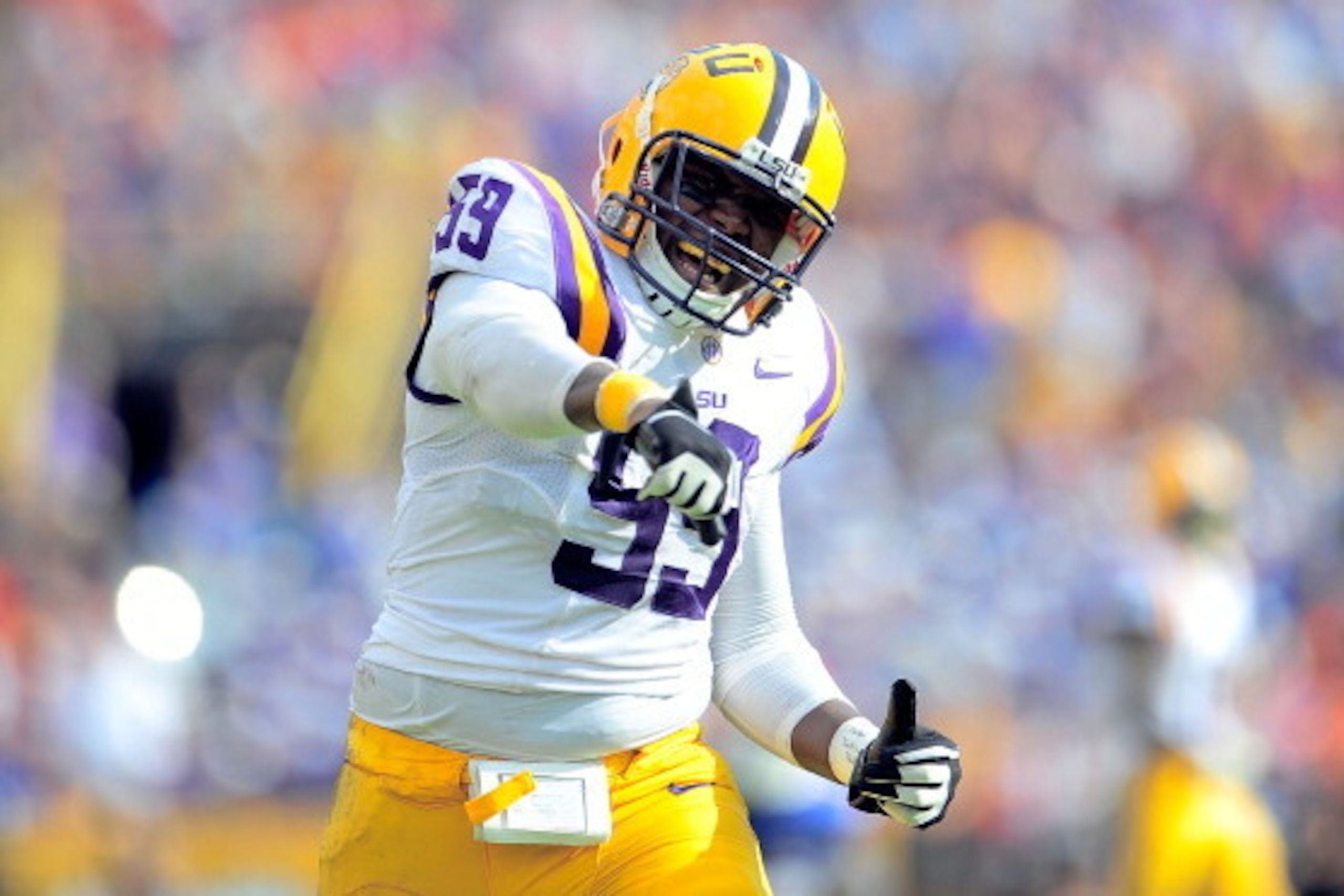 BATON ROUGE, LA - OCTOBER 12:  Jermauria Rasco #59 of the LSU Tigers reacts to a defensive stop against the Florida Gators during a game at Tiger Stadium on October 12, 2013 in Baton Rouge, Louisiana.  (Photo by Stacy Revere/Getty Images)