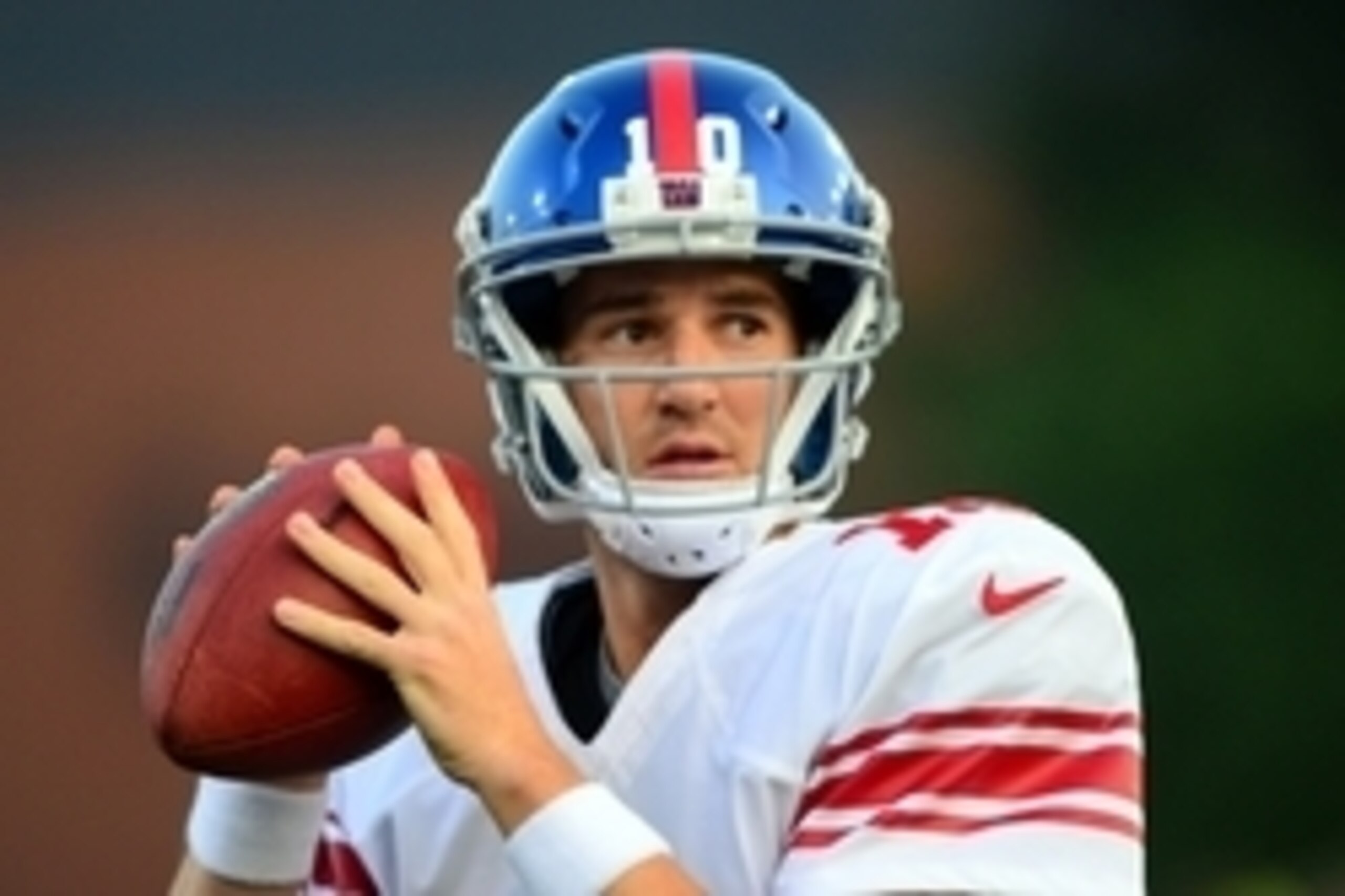 Aug 3, 2014; Canton, OH, USA; New York Giants quarterback Eli Manning (10) looks to throw a pass during the first quarter of the 2014 Pro Football Hall of Fame game against the Buffalo Bills at Fawcett Stadium. Mandatory Credit: Andrew Weber-USA TODAY Spo