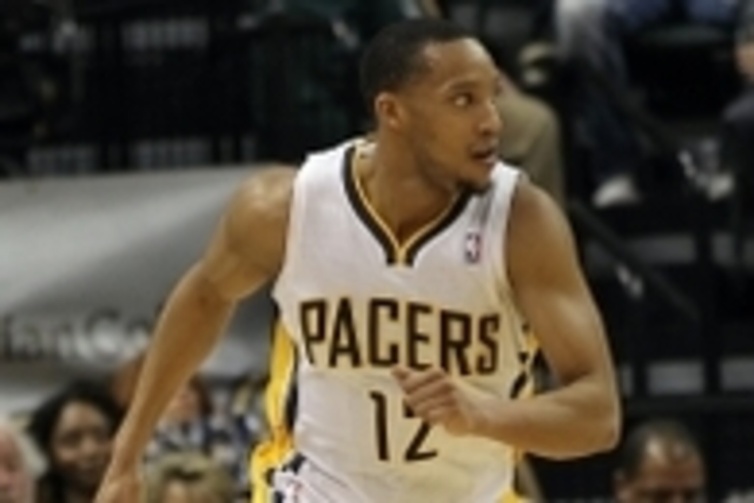 Mar 17, 2014; Indianapolis, IN, USA;  Indiana Pacers forward Evan Turner (12) runs up court during the second quarter against the Philadelphia 76ers at Bankers Life Fieldhouse. The Pacers won 99-90. Mandatory Credit: Pat Lovell-USA TODAY Sports