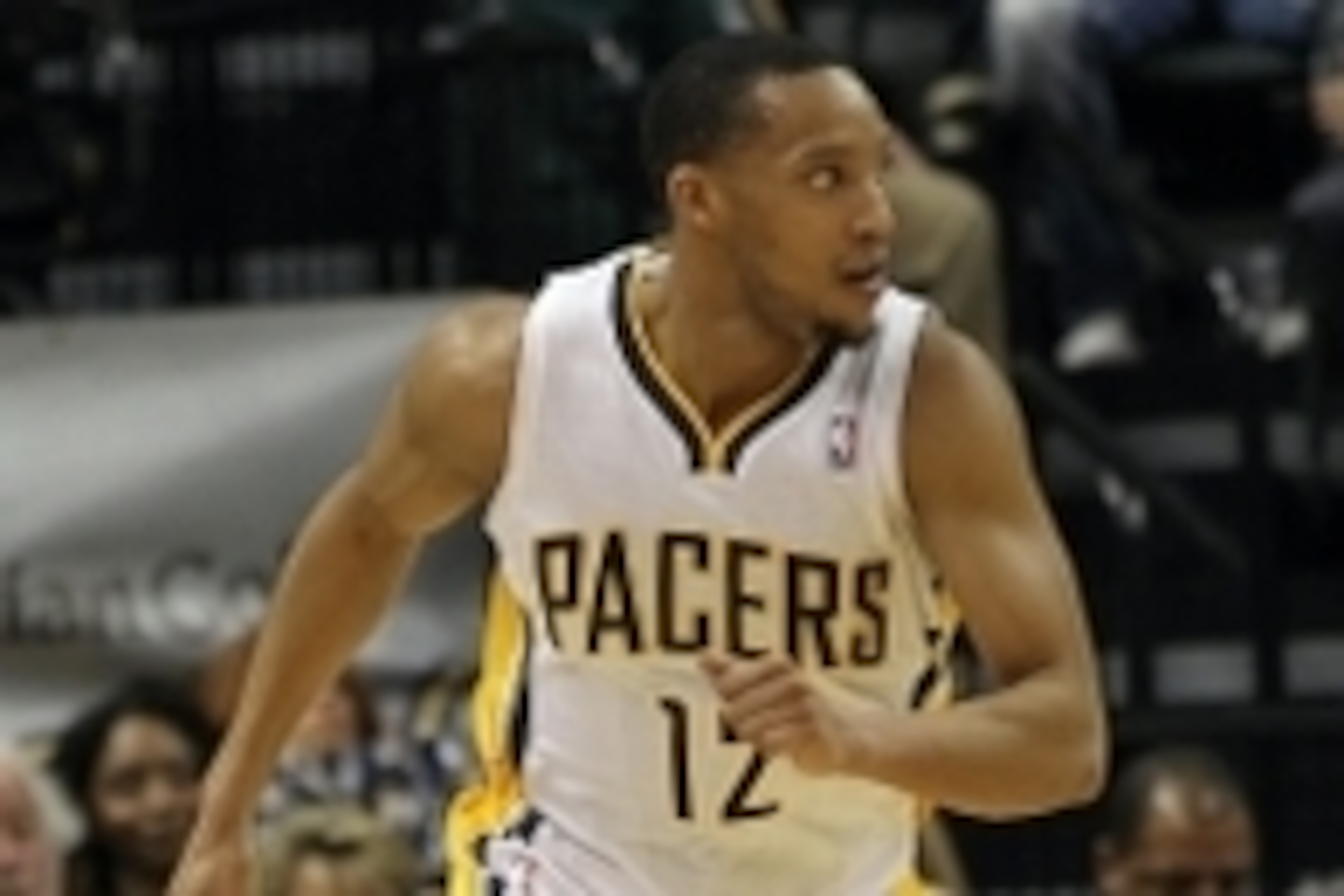 Mar 17, 2014; Indianapolis, IN, USA;  Indiana Pacers forward Evan Turner (12) runs up court during the second quarter against the Philadelphia 76ers at Bankers Life Fieldhouse. The Pacers won 99-90. Mandatory Credit: Pat Lovell-USA TODAY Sports