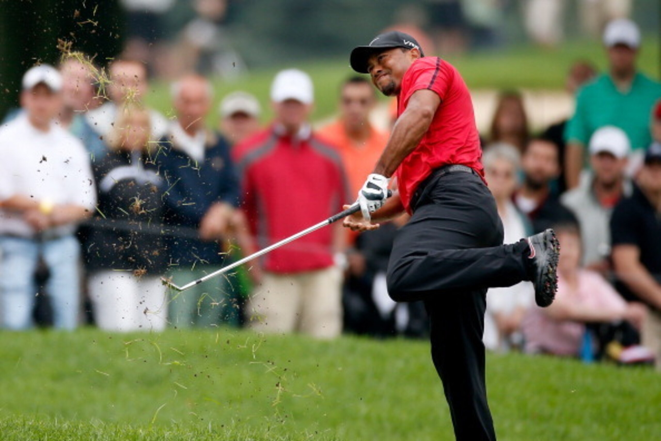 AKRON, OH - AUGUST 03:  Tiger Woods hits out of the rough on the second hole during the final round of the World Golf Championships-Bridgestone Invitational at Firestone Country Club South Course on August 3, 2014 in Akron, Ohio.  (Photo by Gregory Shamus