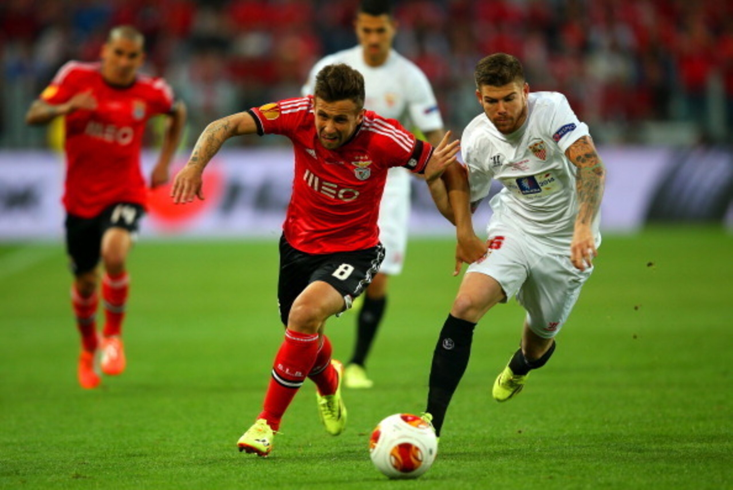 TURIN, ITALY - MAY 14:  Miralem Sulejmani of Benfica vies with Alberto Moreno of Sevilla during the UEFA Europa League Final match between Sevilla FC and SL Benfica at Juventus Stadium on May 14, 2014 in Turin, Italy.  (Photo by Clive Rose/Getty Images)