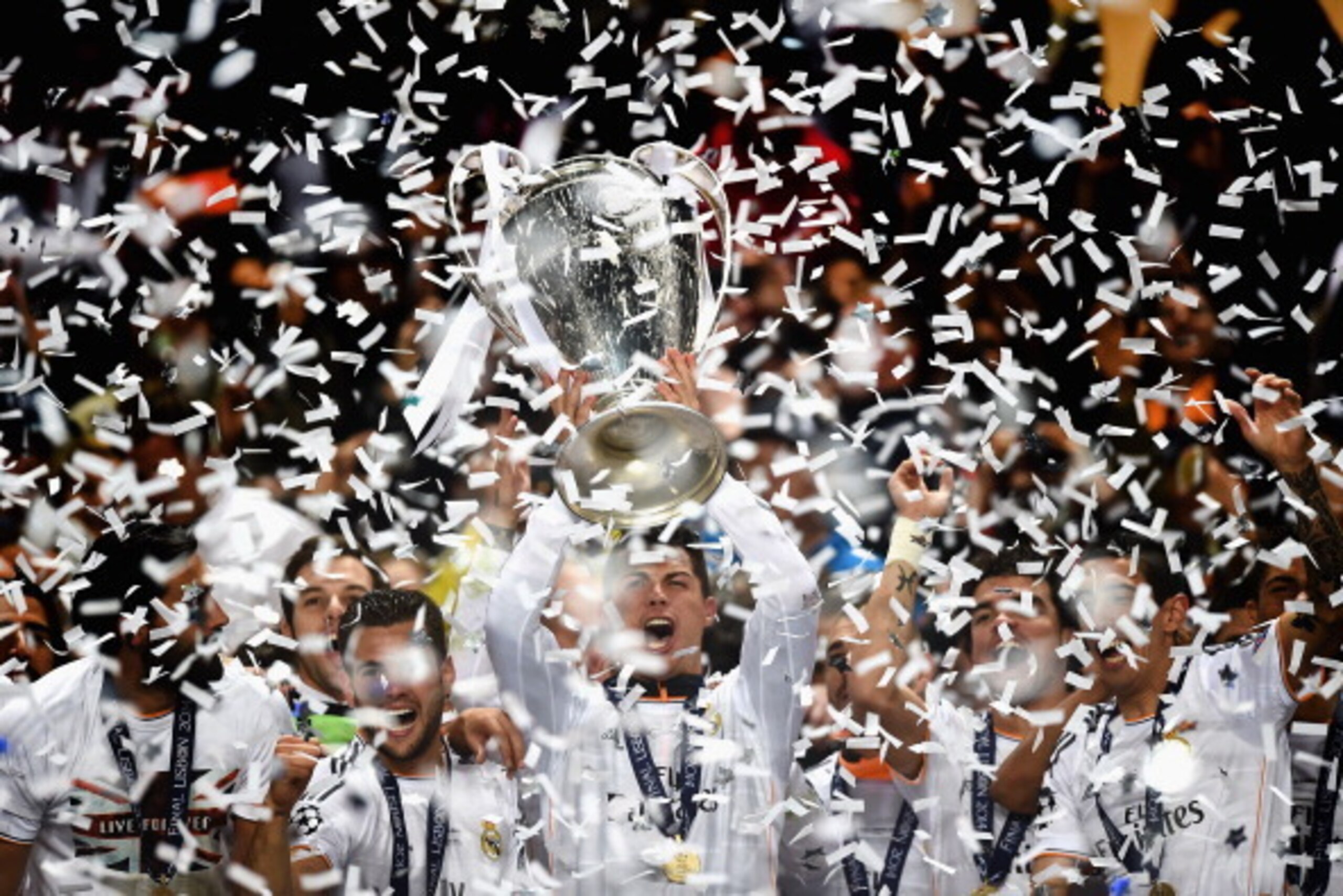 LISBON, PORTUGAL - MAY 24: Cristiano Ronaldo of Real Madrid lifts the Champions league trophy during the during the UEFA Champions League Final between Real Madrid and Atletico de Madrid at Estadio da Luz on May 24, 2014 in Lisbon, Portugal.  (Photo by La