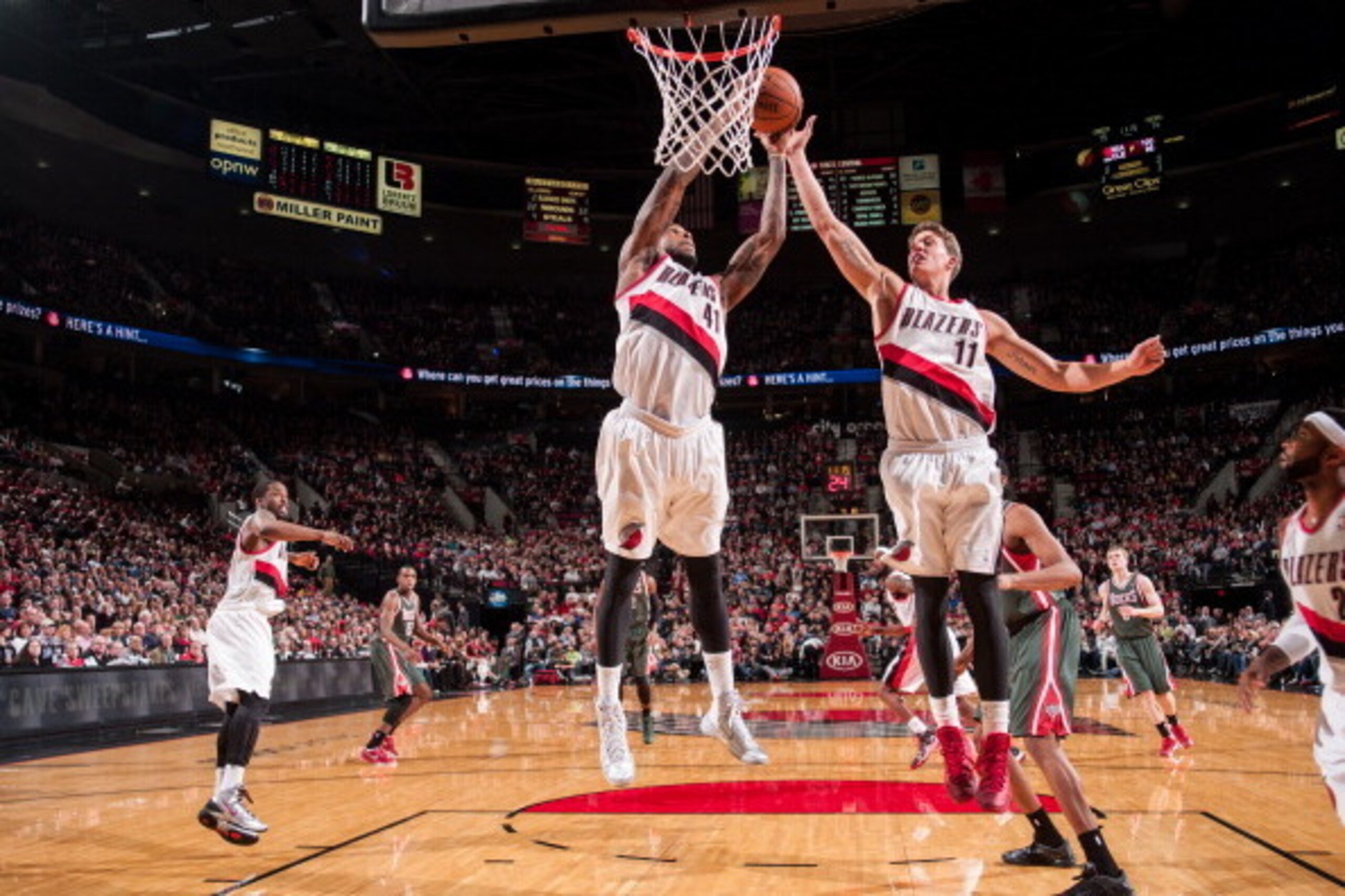 PORTLAND, OR - MARCH 18:  Thomas Robinson #41 and Meyers Leonard #11 of the Portland Trail Blazers goes up for a rebound against the Milwaukee Bucks on March 18, 2014 at the Moda Center Arena in Portland, Oregon. NOTE TO USER: User expressly acknowledges 