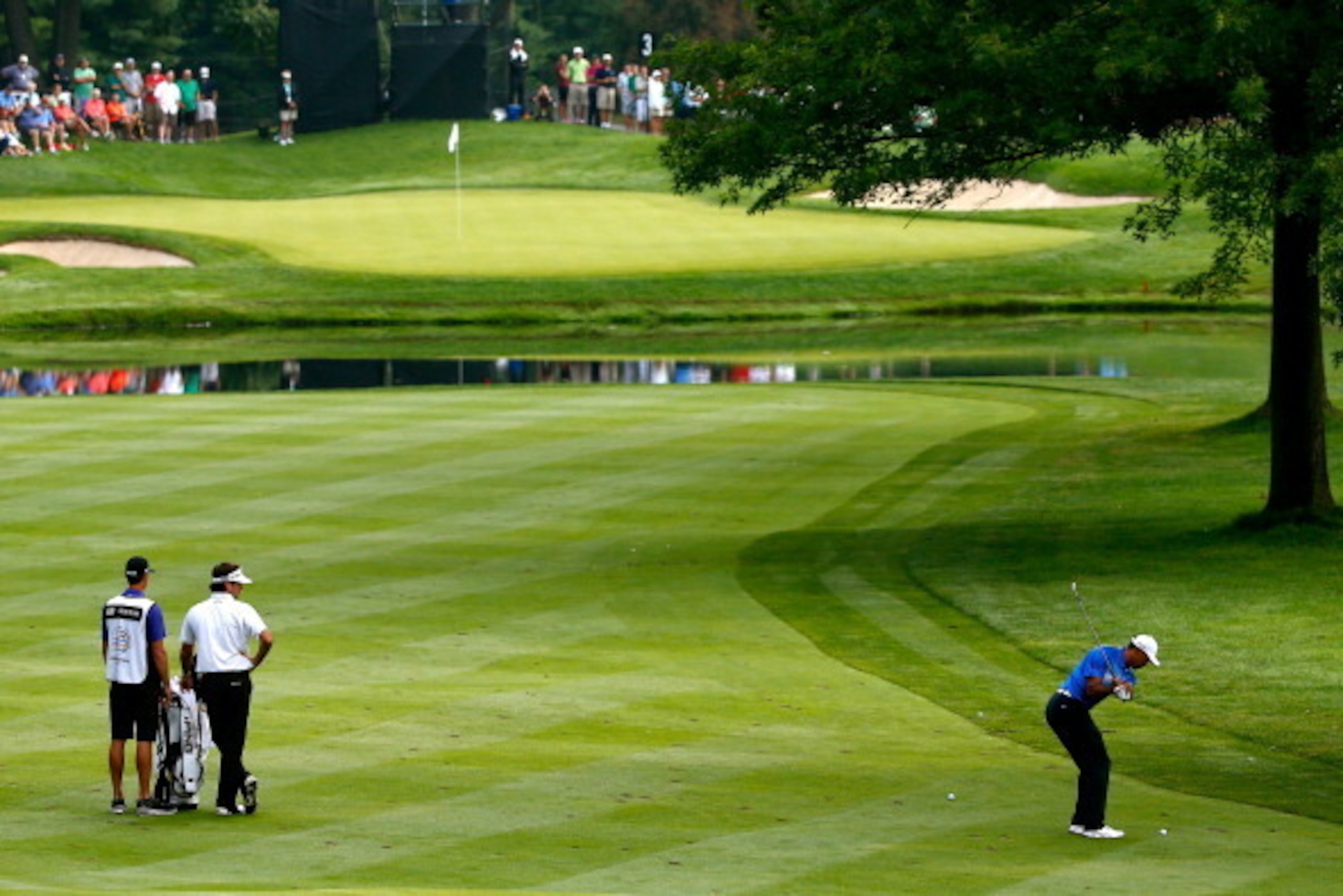 AKRON, OH - AUGUST 02: Tiger Woods hits off the third fairway during the third round of the World Golf Championships-Bridgestone Invitational at Firestone Country Club South Course on August 2, 2014 in Akron, Ohio.  (Photo by Sam Greenwood/Getty Images)