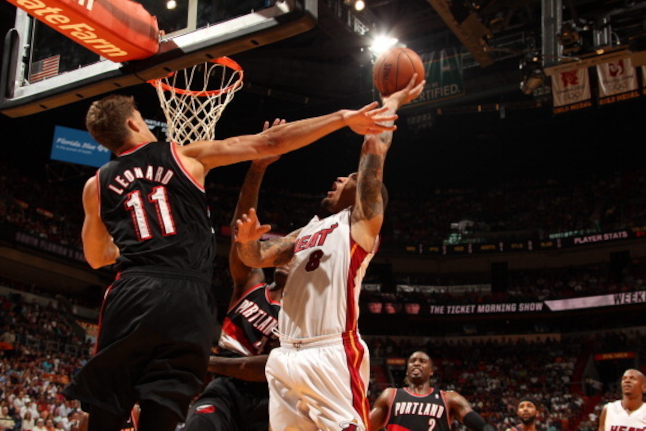 MIAMI, FL - March 24: Michael Beasley #8 of the Miami Heat shoots against the Portland Trail Blazers at the American Airlines Arena in Miami, Florida on March 24 2014. NOTE TO USER: User expressly acknowledges and agrees that, by downloading and/or using 