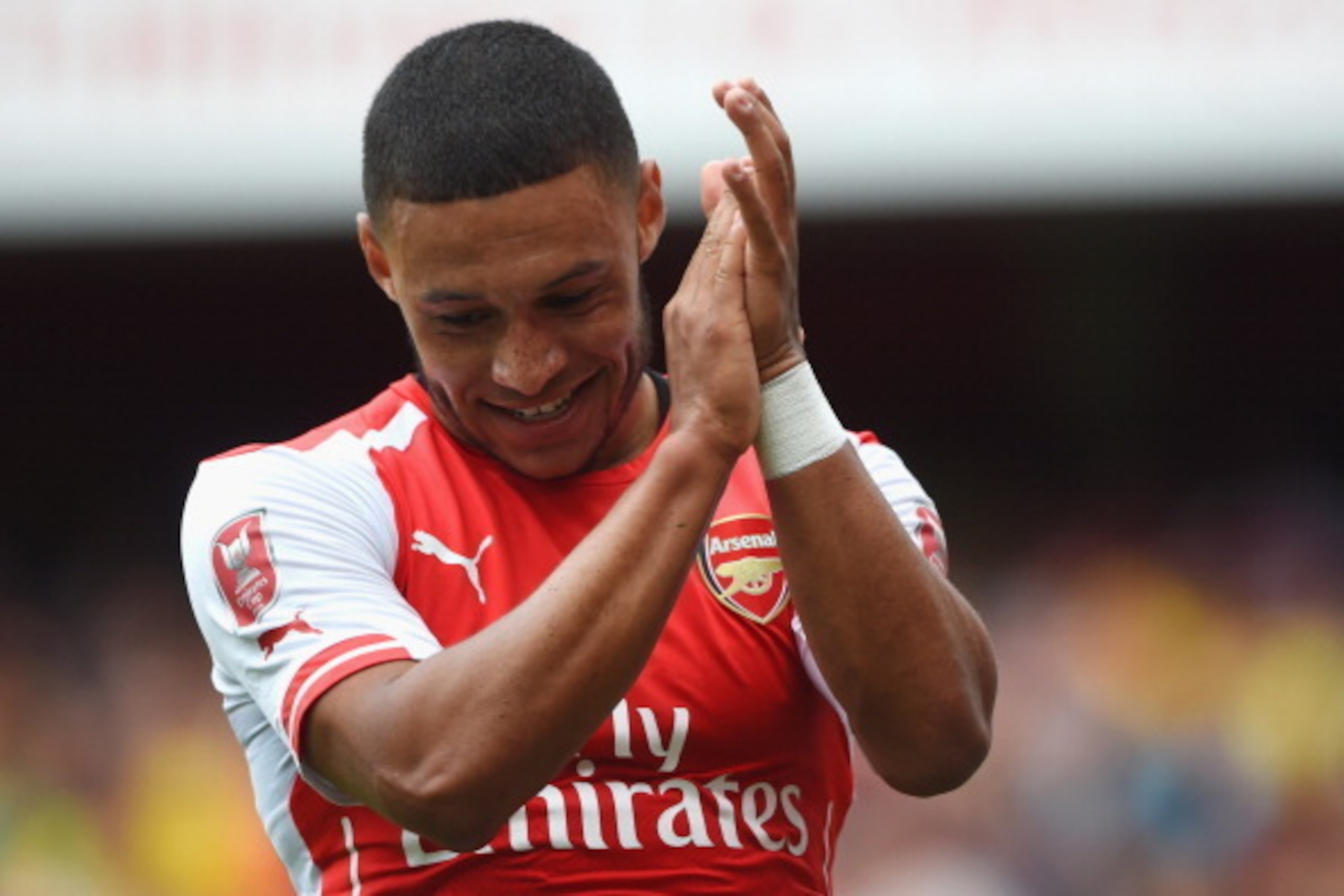 LONDON, ENGLAND - AUGUST 02: Alex Oxlade-Chamberlain looks on during the Emirates Cup match between Arsenal and Benfica at the Emirates Stadium on August 2, 2014 in London, England.  (Photo by Michael Regan/Getty Images)