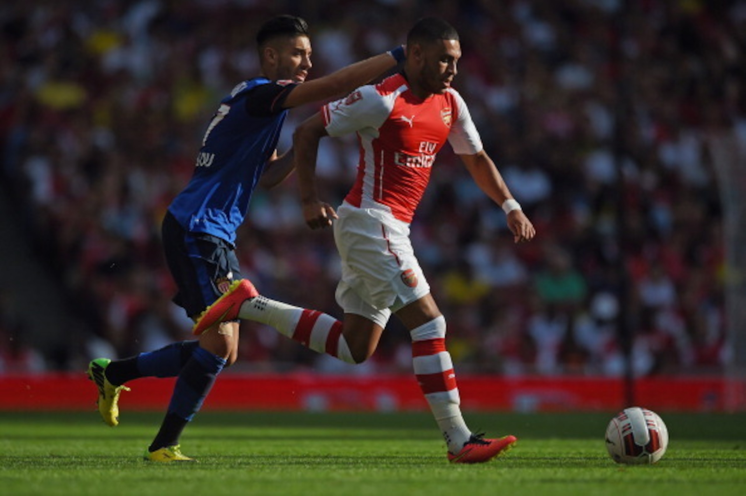 LONDON, ENGLAND - AUGUST 03: Alex Oxlade-Chamberlain of Arsenal in action with Yannick Ferreira-Carrasco of Monaco during the Emirates Cup match between Arsenal and AS Monaco at the Emirates Stadium on August 3, 2014 in London, England.  (Photo by Michael