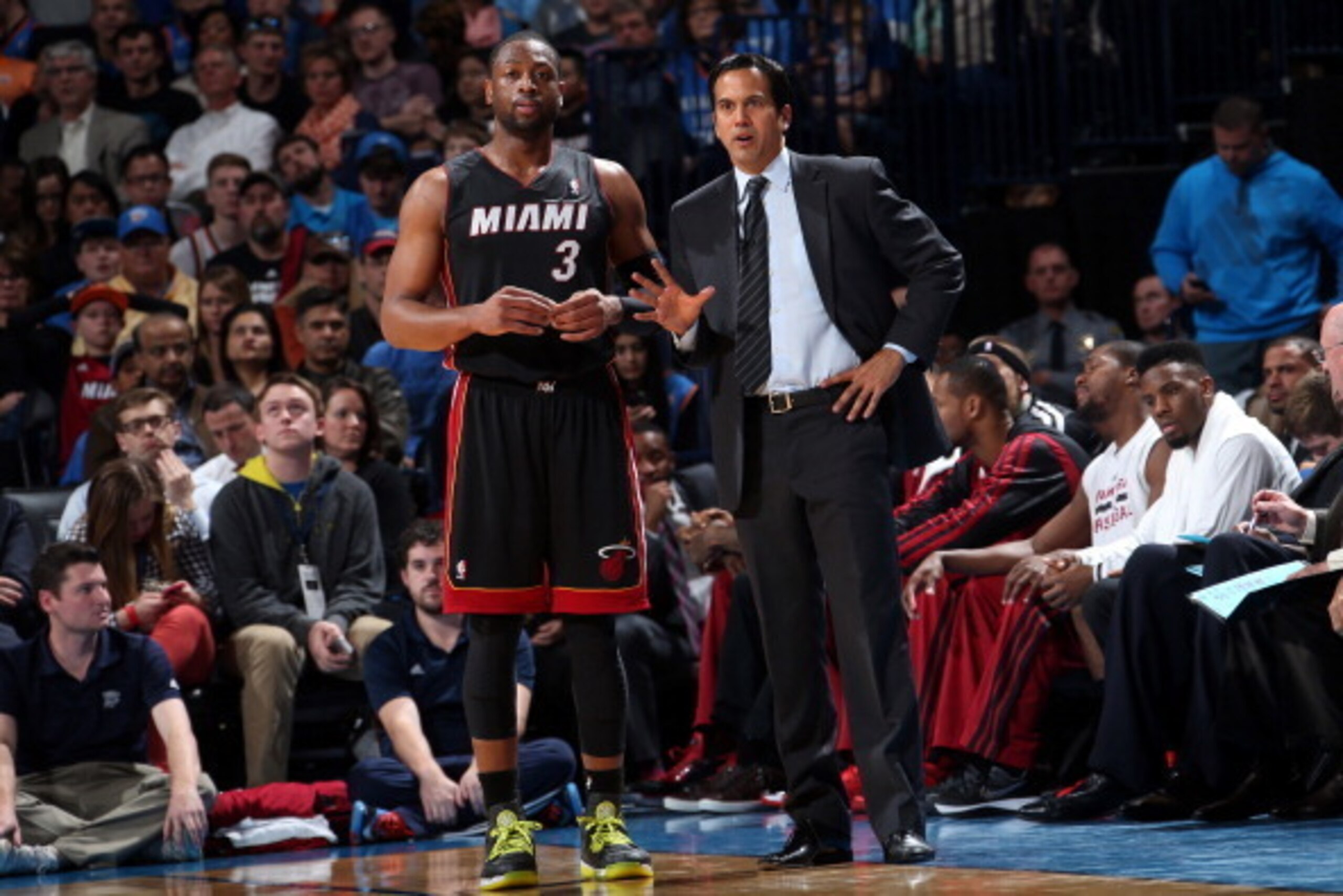 OKLAHOMA CITY, OK - FEBRUARY 20: Dwyane Wade #3 of the Miami Heat talks with Head Coach Erik Spoelstra during the game against the Oklahoma City Thunder on February 20, 2014 at the Chesapeake Energy Arena in Oklahoma City, Oklahoma. NOTE TO USER: User exp