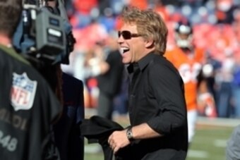 Jan 19, 2014; Denver, CO, USA; American musician Jon Bon Jovi on the field before during the 2013 AFC championship playoff football game between the Denver Broncos and the New England Patriots at Sports Authority Field at Mile High. Mandatory Credit: Matt