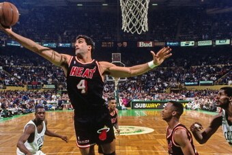 BOSTON - 1991: Rony Seikaly #4 of the Miami Heat rebounds against the Boston Celtics at the Boston Garden in Boston, Massachusetts circa 1991. NOTE TO USER: User expressly acknowledges and agrees that, by downloading and or using this photograph, User is 