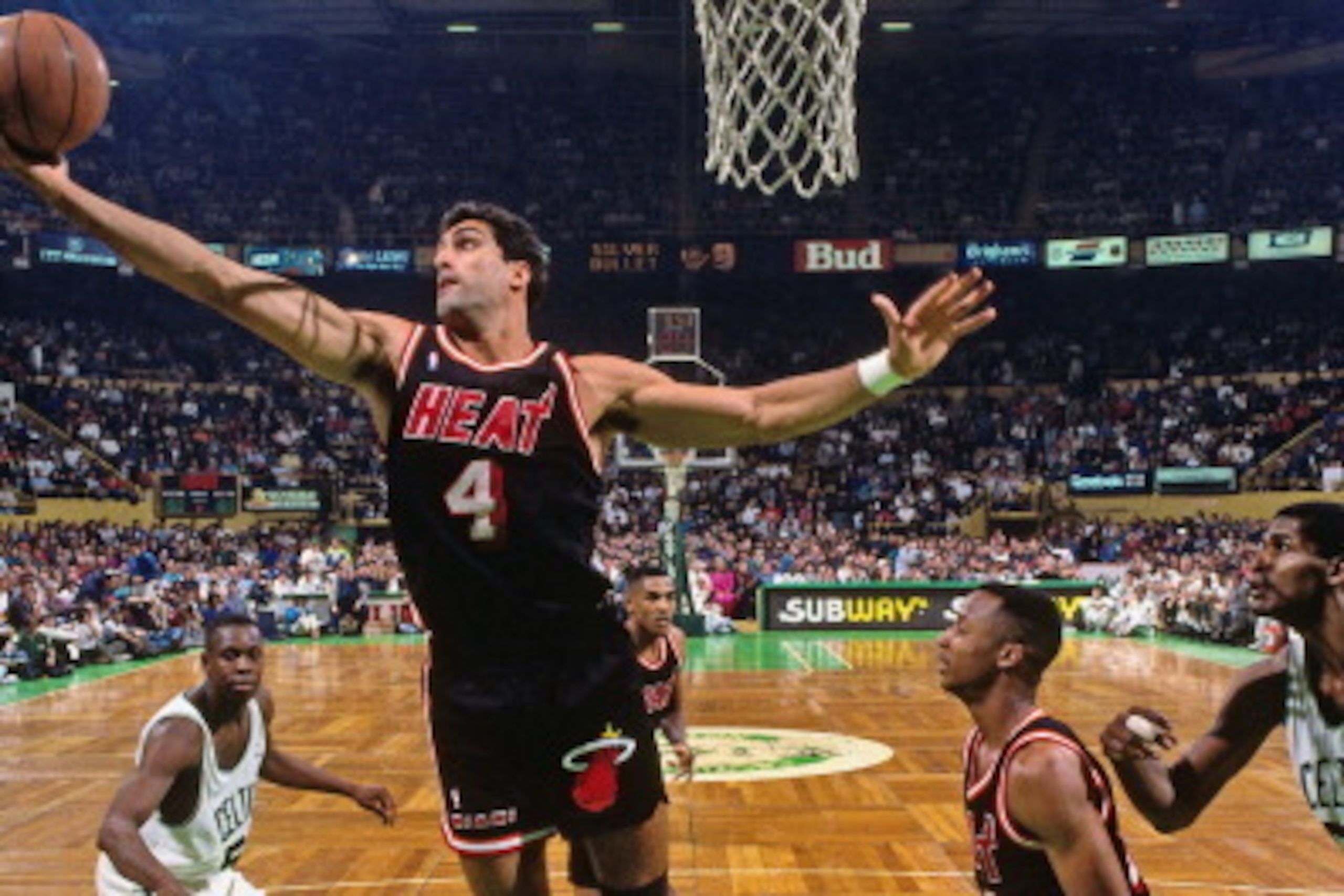 BOSTON - 1991: Rony Seikaly #4 of the Miami Heat rebounds against the Boston Celtics at the Boston Garden in Boston, Massachusetts circa 1991. NOTE TO USER: User expressly acknowledges and agrees that, by downloading and or using this photograph, User is 