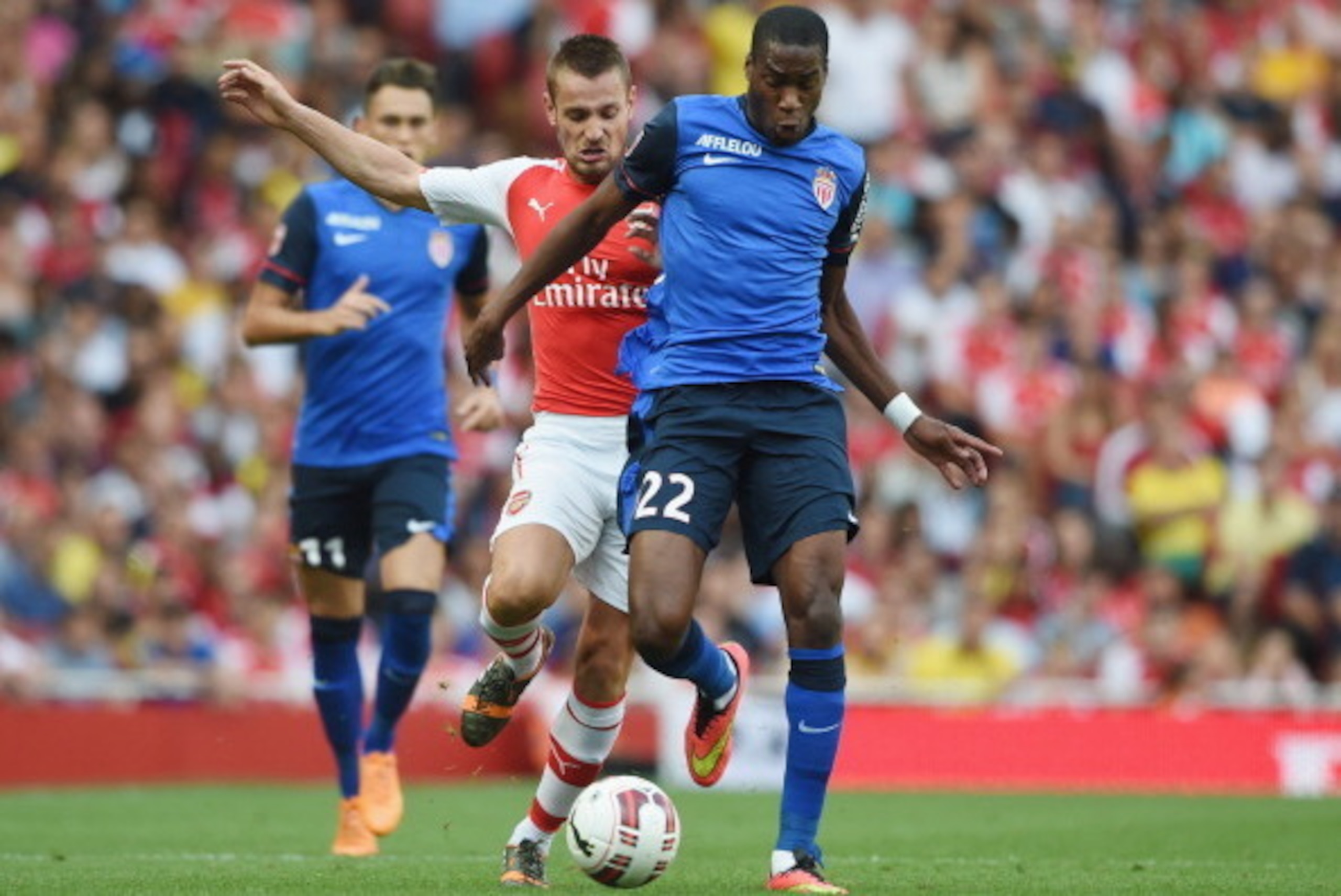 LONDON, ENGLAND - AUGUST 03: Mathieu Debuchy of Arsenal in action with Geoffrey Kondogbia of Monaco during the Emirates Cup match between Arsenal and AS Monaco at the Emirates Stadium on August 3, 2014 in London, England.  (Photo by Michael Regan/Getty Im