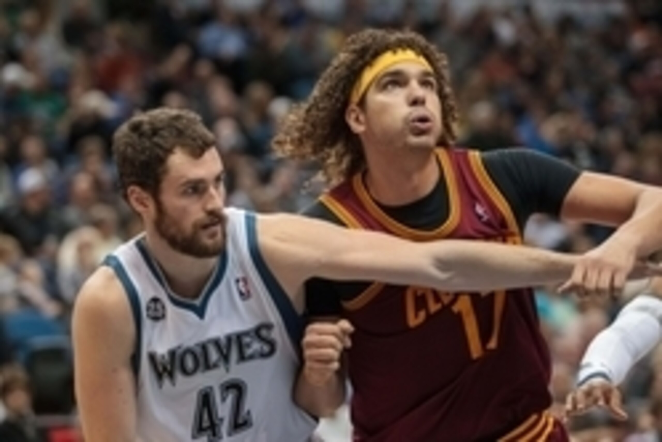 Nov 13, 2013; Minneapolis, MN, USA; Minnesota Timberwolves power forward Kevin Love (42) and Cleveland Cavaliers center Anderson Varejao (17) battle for position in the second quarter at Target Center. Mandatory Credit: Brad Rempel-USA TODAY Sports