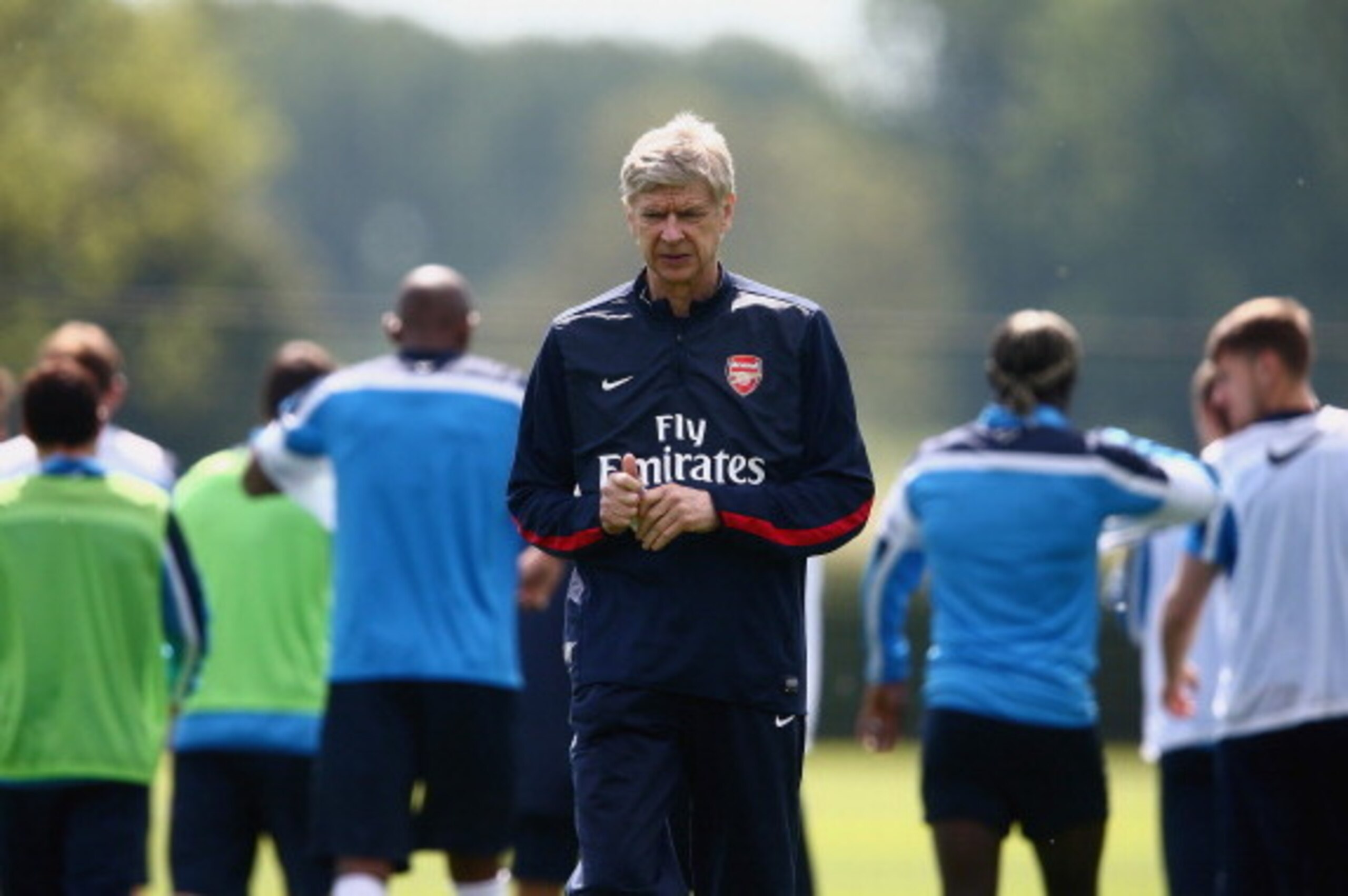 ST ALBANS, ENGLAND - MAY 14:  Arsene Wenger of Arsenal looks on during a training session ahead of the FA Cup Final match between Arsenal and Hull City at London Colney on May 14, 2014 in St Albans, England.  (Photo by Clive Mason/Getty Images)
