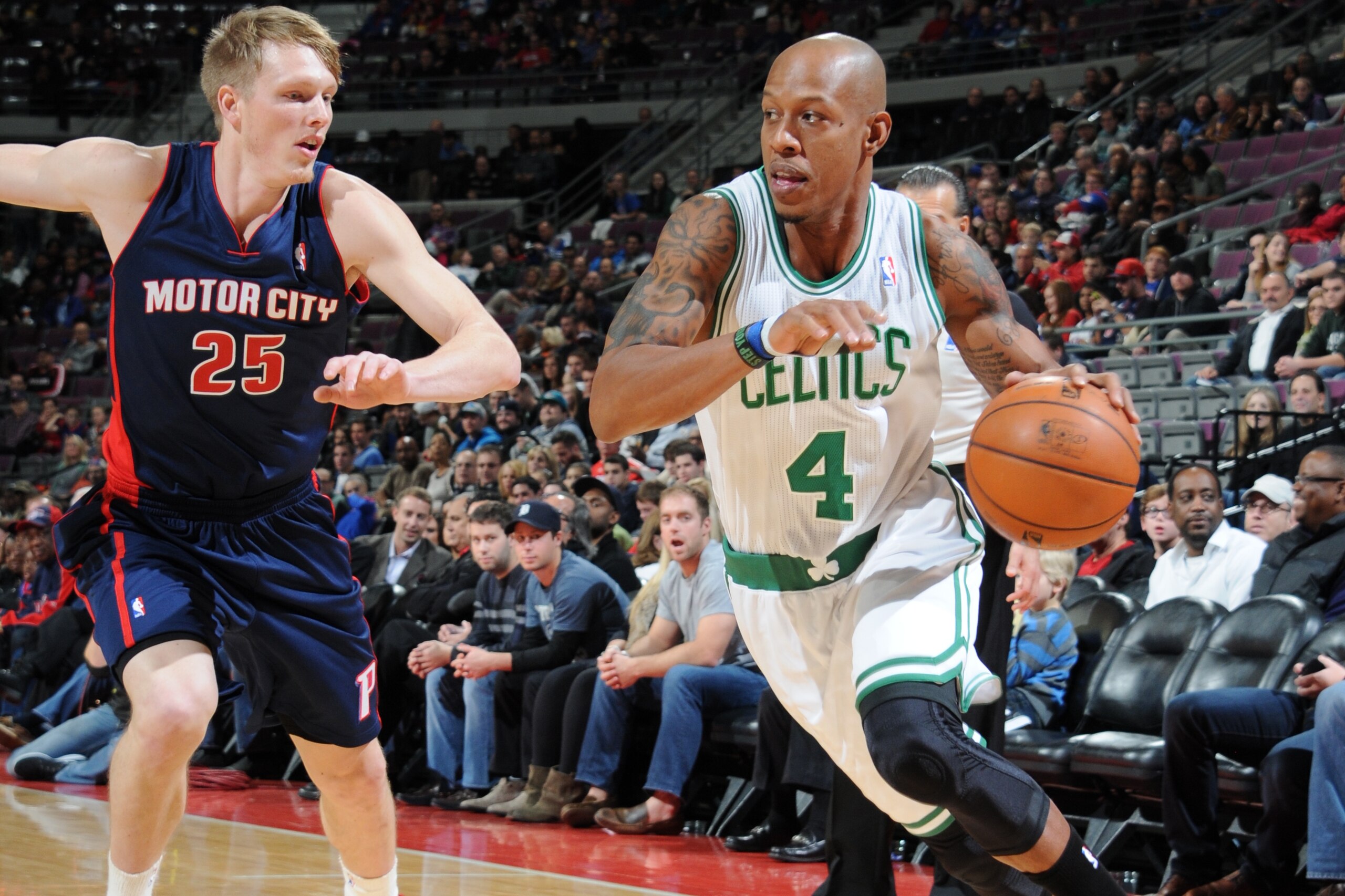 AUBURN HILLS, MI - NOVEMBER 3: Keith Bogans #4 of the Boston Celtics drives to the basket against Kyle Singler #25 of the Detroit Pistons on November 3, 2013 at The Palace of Auburn Hills in Auburn Hills, Michigan. NOTE TO USER: User expressly acknowledge AUBURN HILLS, MI - NOVEMBER 3: Keith Bogans #4 of the Boston Celtics drives to the basket against Kyle Singler #25 of the Detroit Pistons on November 3, 2013 at The Palace of Auburn Hills in Auburn Hills, Michigan. NOTE TO USER: User expressly acknowledge