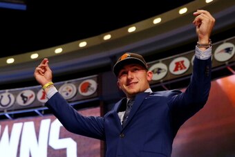 NEW YORK, NY - MAY 08:  Johnny Manziel of the Texas A&M Aggies takes the stage after he was picked #22 overall by the Cleveland Browns during the first round of the 2014 NFL Draft at Radio City Music Hall on May 8, 2014 in New York City.  (Photo by Elsa/G
