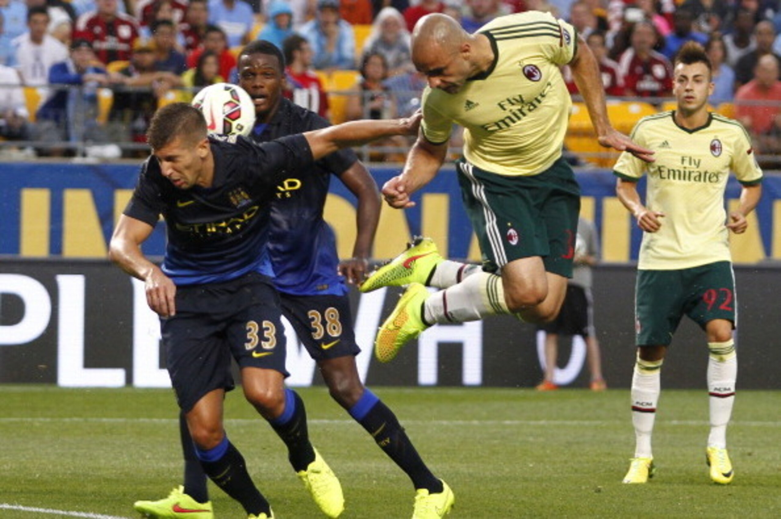PITTSBURGH, PA - JULY 27:  Alex Rodrigo Dias da Costa #33 of AC Milan heads a ball in the first half against Matija NastasiÄ #33 of Manchester City during International Champions Cup 2014 at Heinz Field on July 27, 2014 in Pittsburgh, Pennsylvania.  (Phot