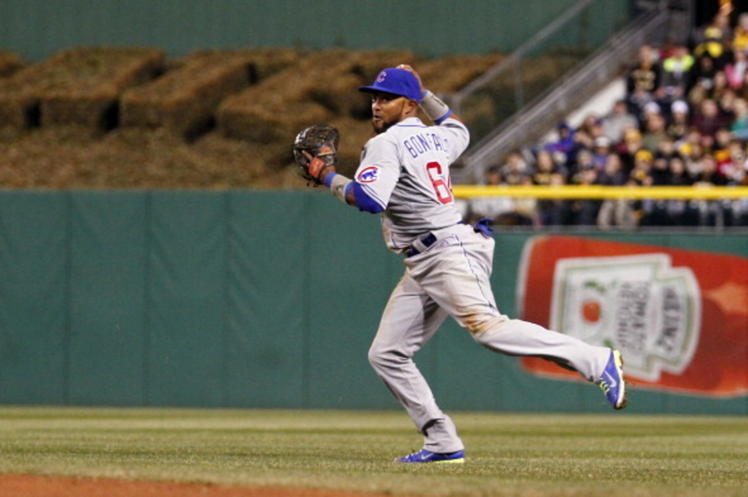 PITTSBURGH, PA - APRIL 02:  Emilio Bonifacio #64 of the Chicago Cubs fields a ground ball in the third inning against the Pittsburgh Pirates during the game at PNC Park April 2, 2014 in Pittsburgh, Pennsylvania.  (Photo by Justin K. Aller/Getty Images)