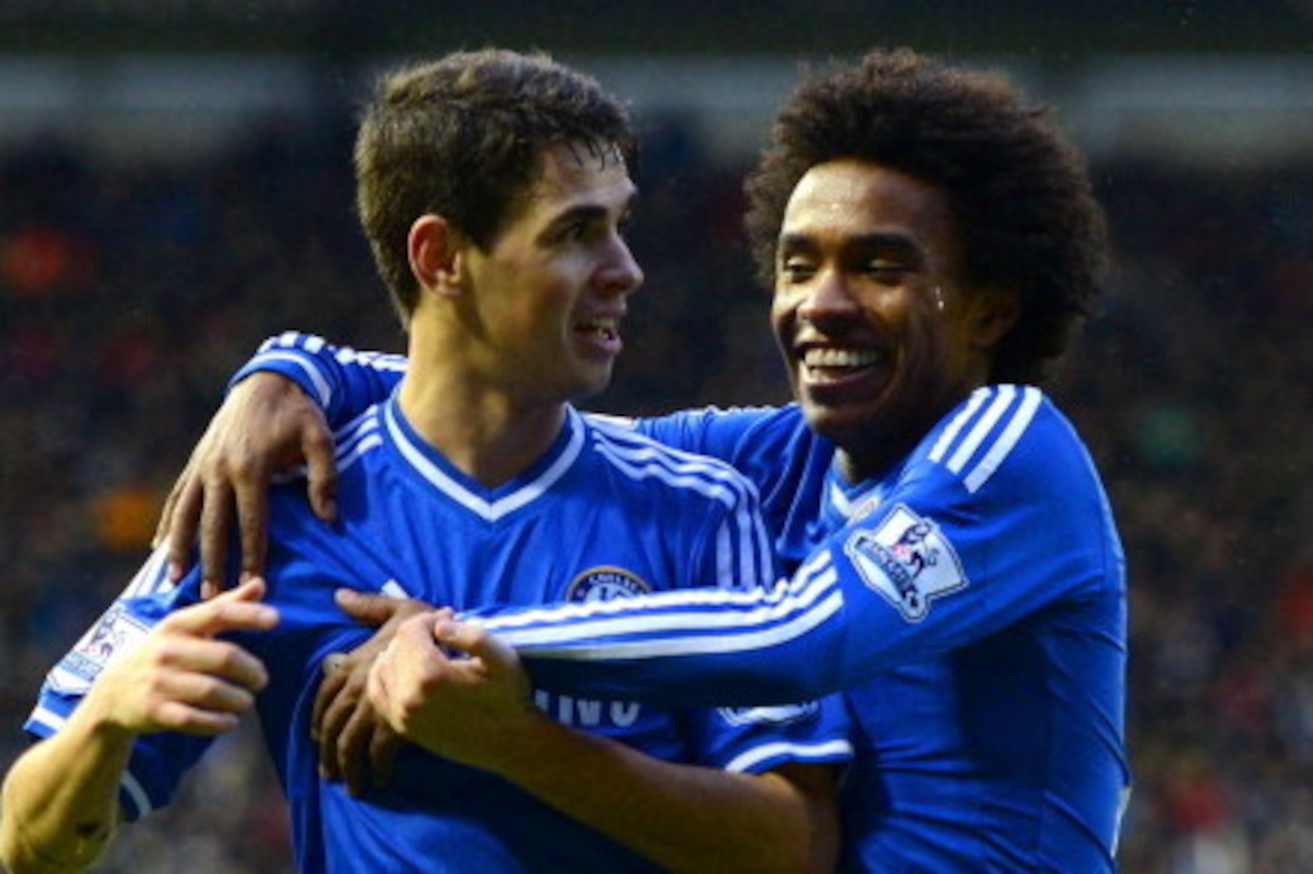 DERBY, ENGLAND - JANUARY 05:  Willian of Chelsea (R) congratulates Oscar of Chelsea on scoring their second goal during the Budweiser FA Cup Third Round match between Derby County and Chelsea at iPro Stadium on January 5, 2014 in Derby, England.  (Photo b