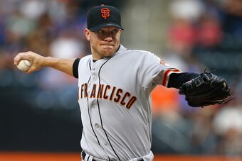 NEW YORK, NY - AUGUST 2:  Jake Peavy #43 of the San Francisco Giants delivers a pitch against the New York Mets in the first inning on August 2, 2014 at Citi Field in the Flushing neighborhood of the Queens borough of New York City. (Photo by Rich Schultz