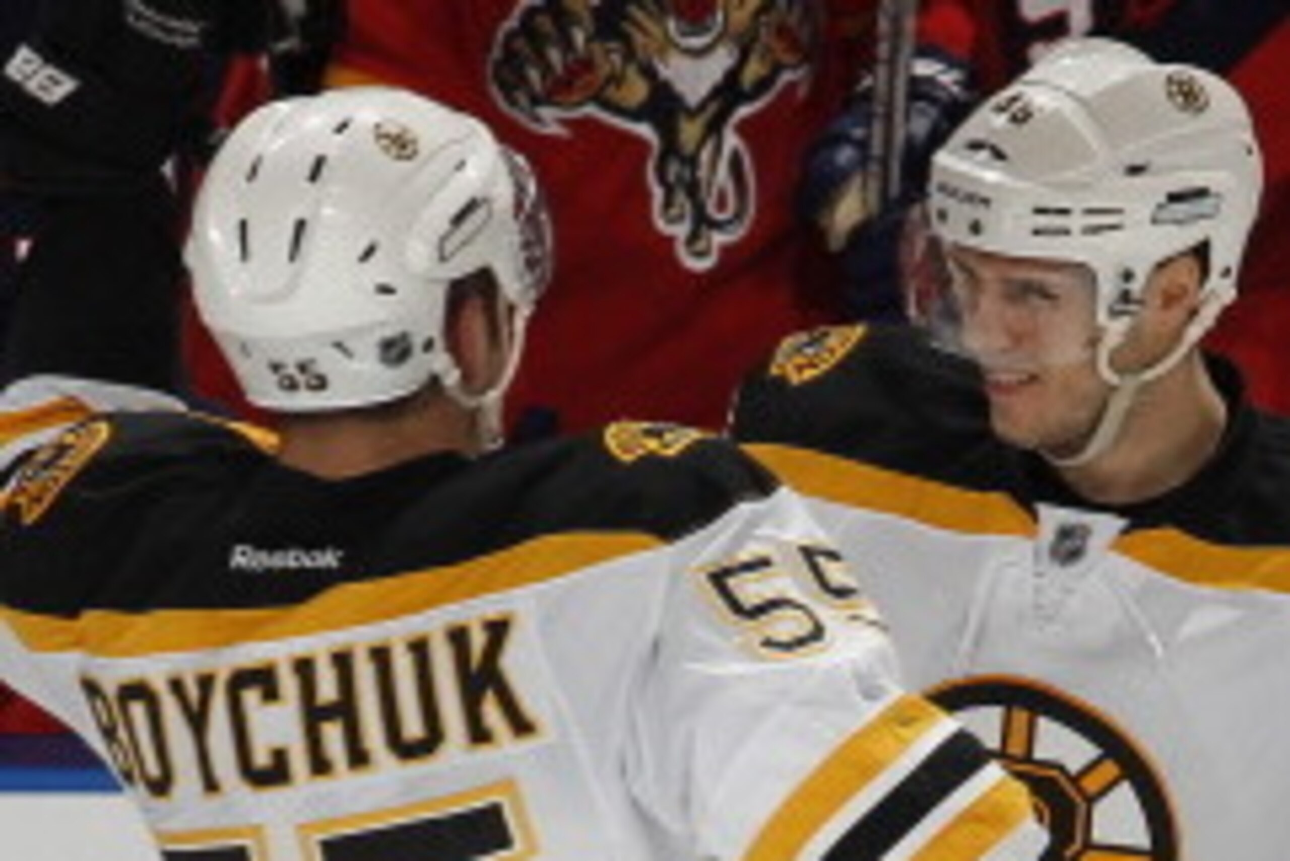SUNRISE, FL - JANUARY 16: David Krejci #46 is congratulated by Johnny Boychuk #55 of the Boston Bruins after scoring the game-winning goal in the shoot-out against the Florida Panthers on January 16, 2012 at the BankAtlantic Center in Sunrise, Florida. Th