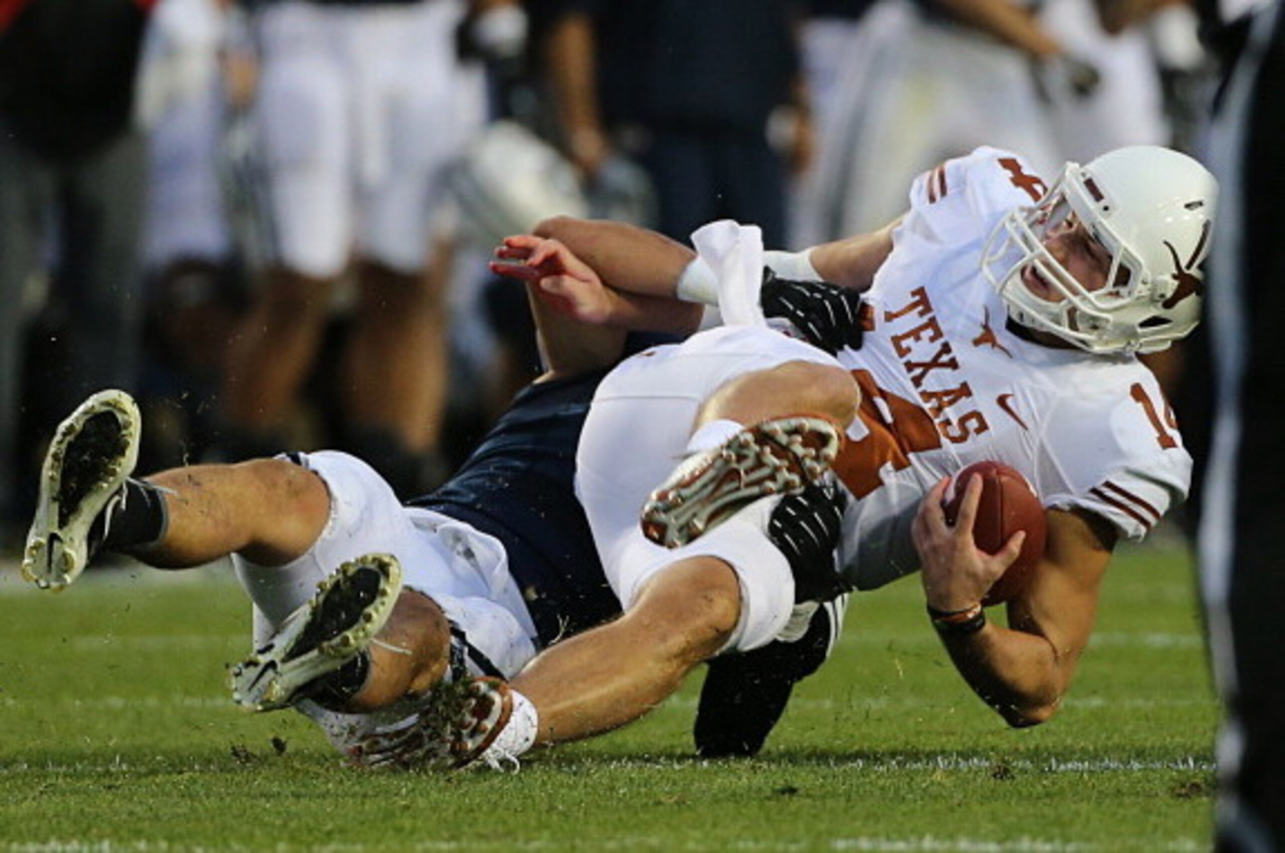 PROVO, UT - SEPTEMBER 7: Alani Fua #5 of BYU Cougars sacks quarterback David Ash #14 of the Texas Longhorns during the first half of an NCAA football game September 7, 2013 at LaVell Edwards Stadium in Provo, Utah. (Photo by George Frey/Getty Images)