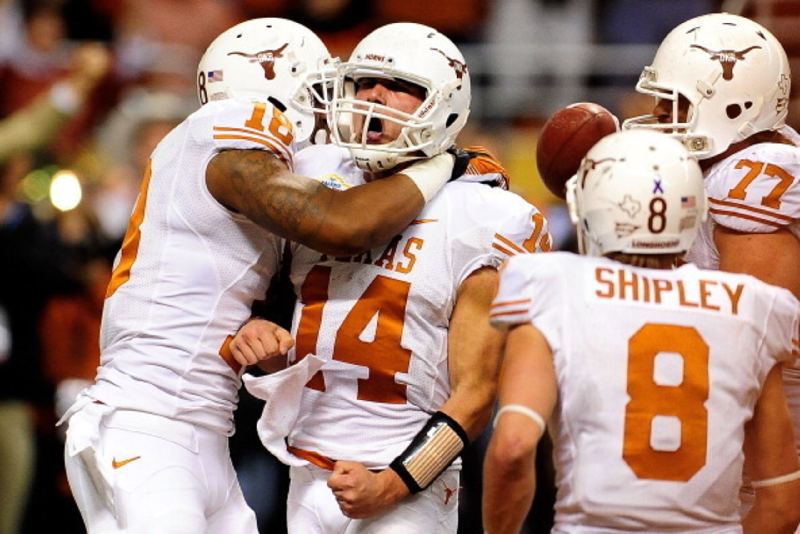SAN ANTONIO, TX - DECEMBER 29:  David Ash #14 of the University of Texas Longhorns celebrates a touchdown against the Oregon State Beavers during the Valero Alamo Bowl at the Alamodome on December 29, 2012 in San Antonio, Texas.  Texas won the game 31-27.