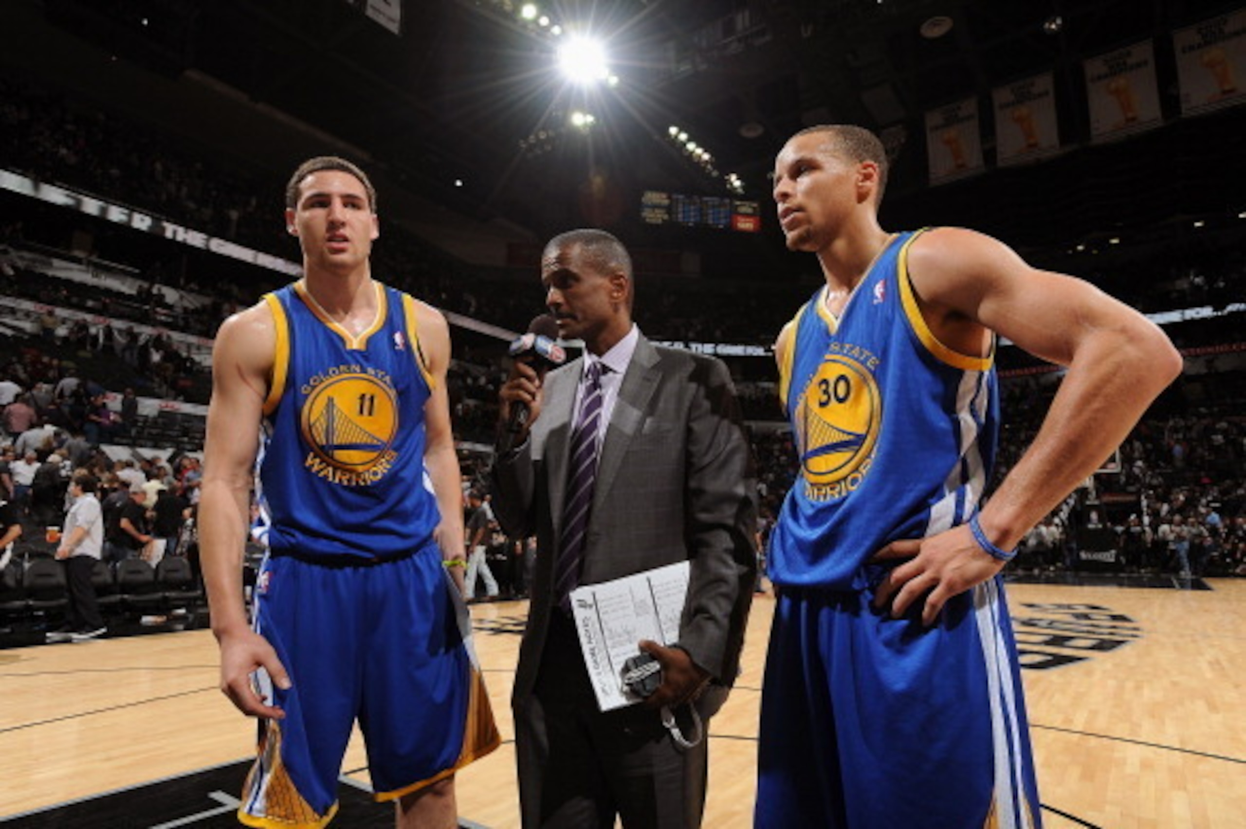 SAN ANTONIO, TX - MAY 8: Stephen Curry #30 and Klay Thompson #11 of the Golden State Warriors get interviewed after the game against the San Antonio Spurs in Game Two of the Western Conference Semifinals during the 2013 NBA Playoffs on May 8, 2013 at the 