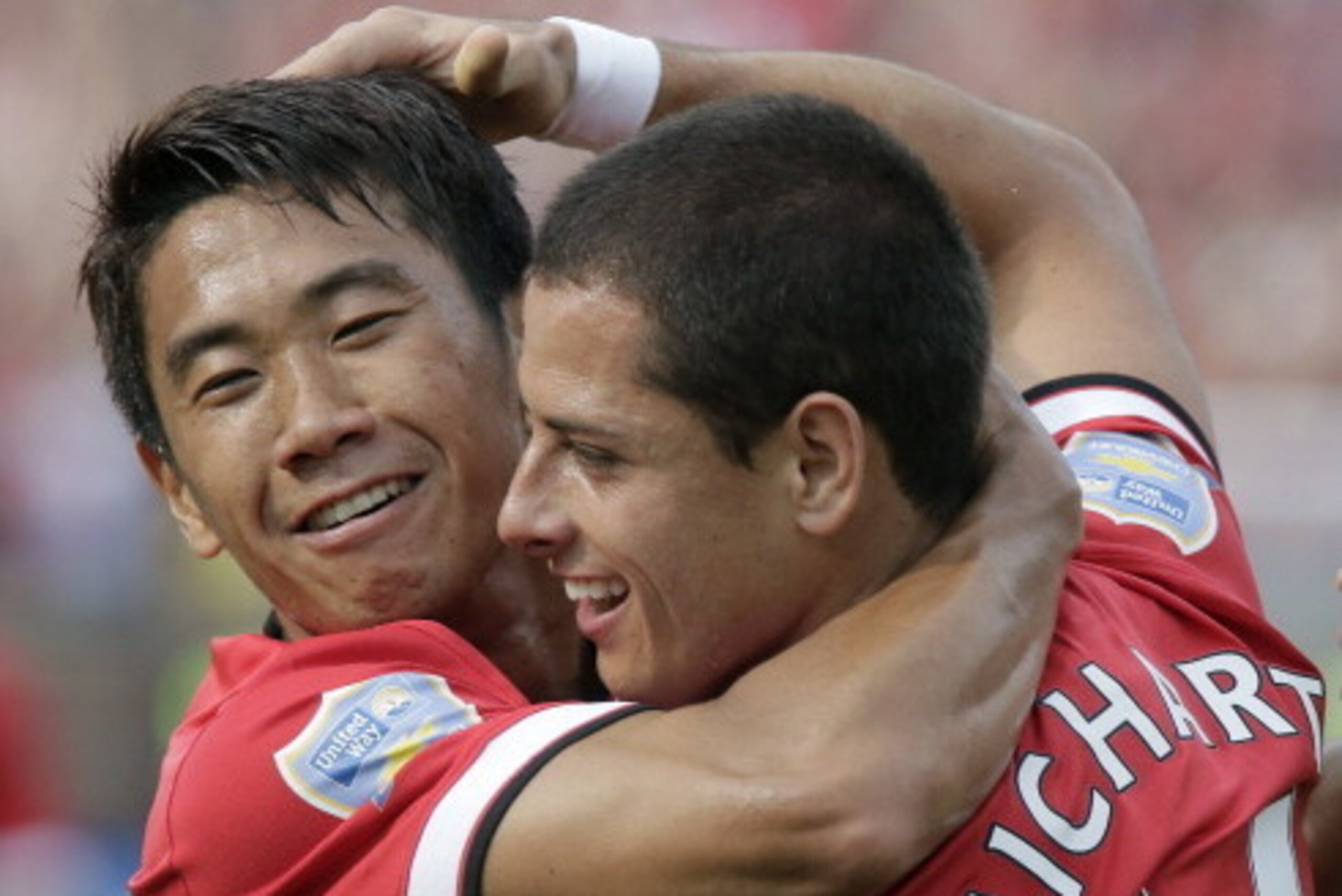 ANN ARBOR, MI - AUGUST 2:  Javier Hernandez #14 of Manchester United celebrates his second half goal with Shinji Kagawa #26 during the Guinness International Champions Cup at Michigan Stadium on August 2, 2014, in Ann Arbor, Mich (Photo by Duane Burleson/