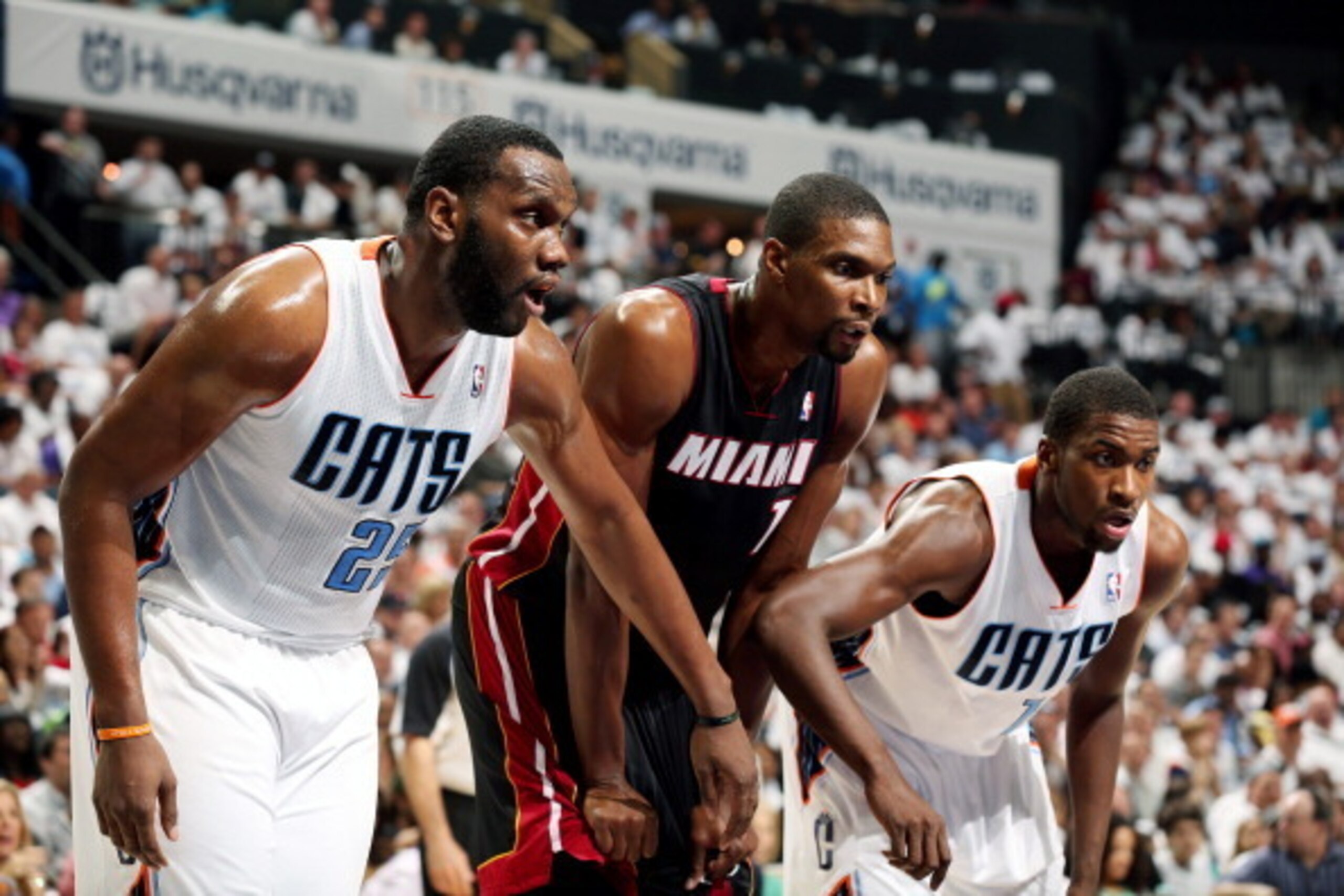 CHARLOTTE, NC - APRIL 26: Al Jefferson #25 and Michael Kidd-Gilchrist #14 of the Charlotte Bobcats battle for position against Chris Bosh #1 of the Miami Heat in Game Three of the Eastern Conference Quarterfinals of the 2014 NBA playoffs at the Time Warne CHARLOTTE, NC - APRIL 26: Al Jefferson #25 and Michael Kidd-Gilchrist #14 of the Charlotte Bobcats battle for position against Chris Bosh #1 of the Miami Heat in Game Three of the Eastern Conference Quarterfinals of the 2014 NBA playoffs at the Time Warne