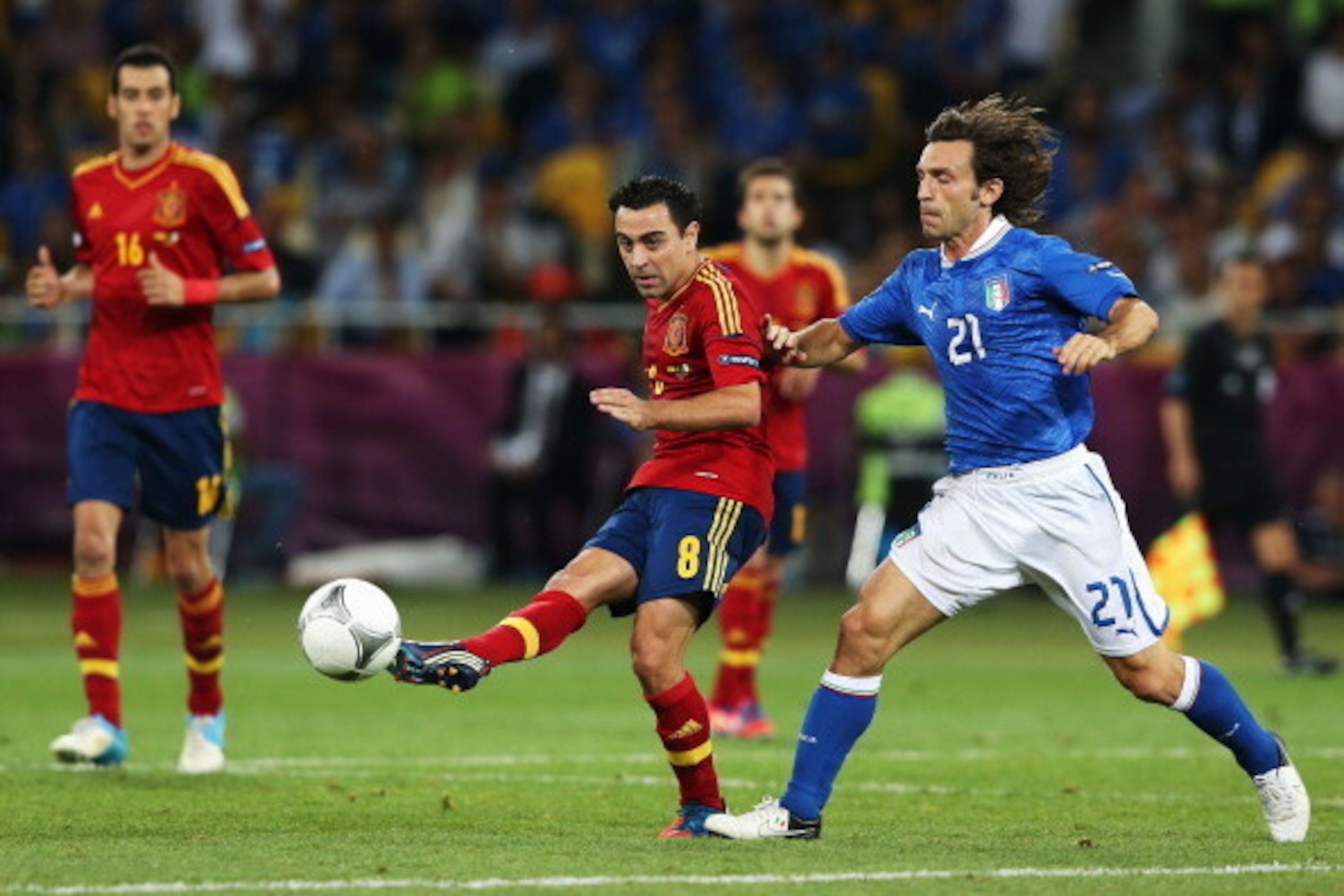 KIEV, UKRAINE - JULY 01:  Xavi Hernandez of Spain in action against Andrea Pirlo of Italy during the UEFA EURO 2012 final match between Spain and Italy at the Olympic Stadium on July 1, 2012 in Kiev, Ukraine.  (Photo by Alex Grimm/Getty Images)
