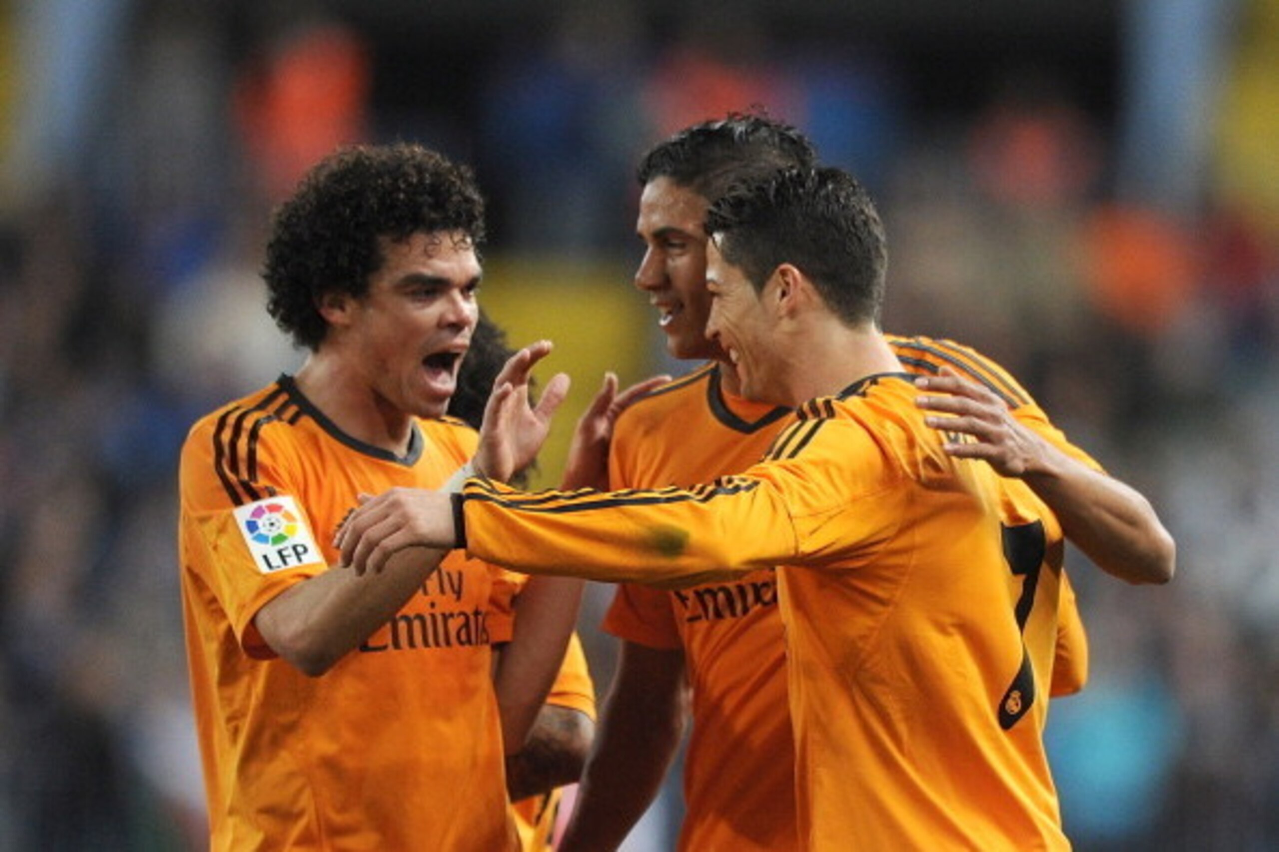 MALAGA, SPAIN - MARCH 15:  Cristiano Ronaldo (R) of Real Madrid celebrates with Pepe (L) and Raphael Varane after scoring Real's opening goal during the La Liga match between Malaga and Real Madrid at La Rosaleda Stadium on March 15, 2014 in Malaga, Spain