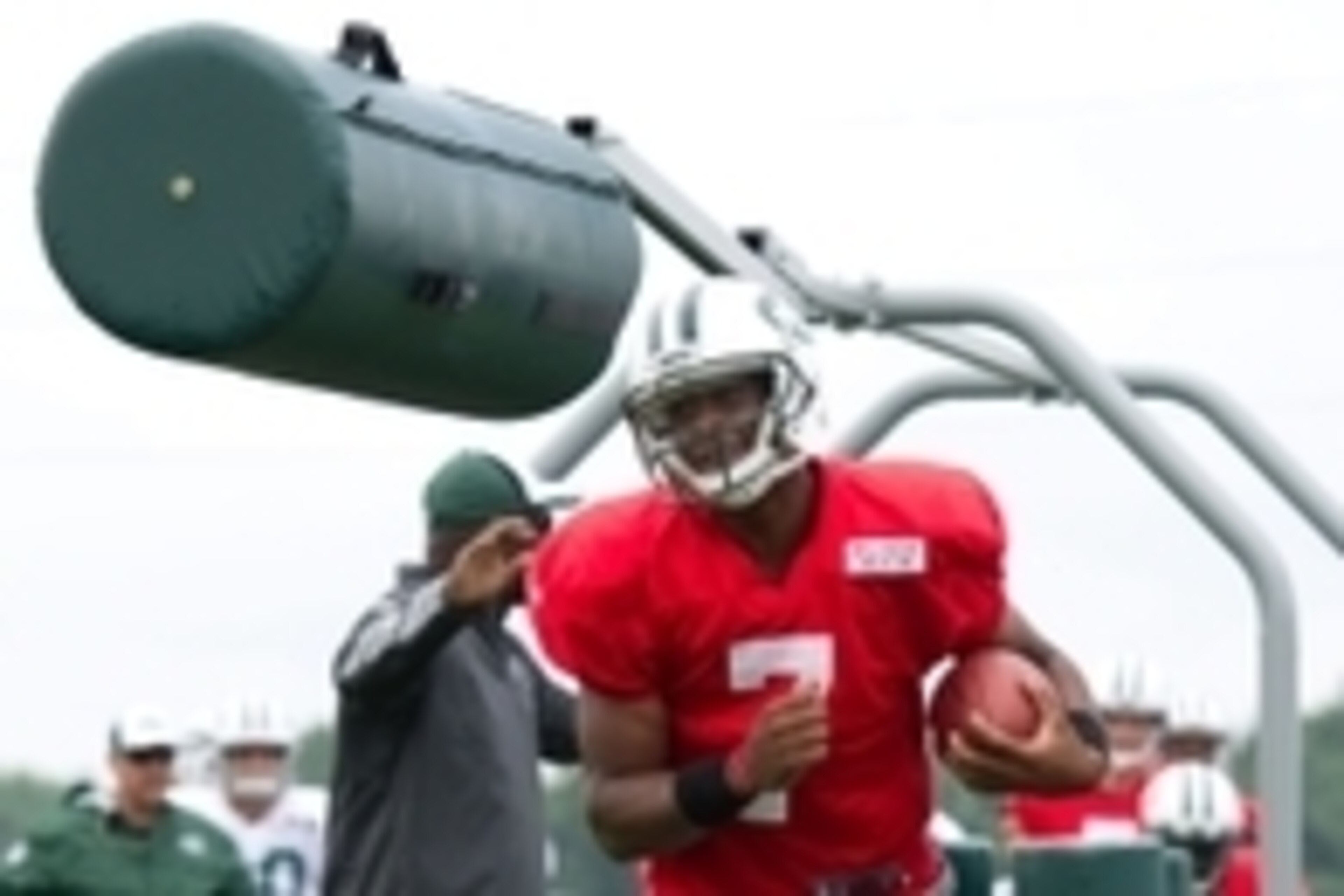 Aug 4, 2014; Cortland, NY, USA; New York Jets quarterback Geno Smith (7) runs with the ball during drills at training camp at SUNY Cortland. Mandatory Credit: Rich Barnes-USA TODAY Sports Aug 4, 2014; Cortland, NY, USA; New York Jets quarterback Geno Smith (7) runs with the ball during drills at training camp at SUNY Cortland. Mandatory Credit: Rich Barnes-USA TODAY Sports