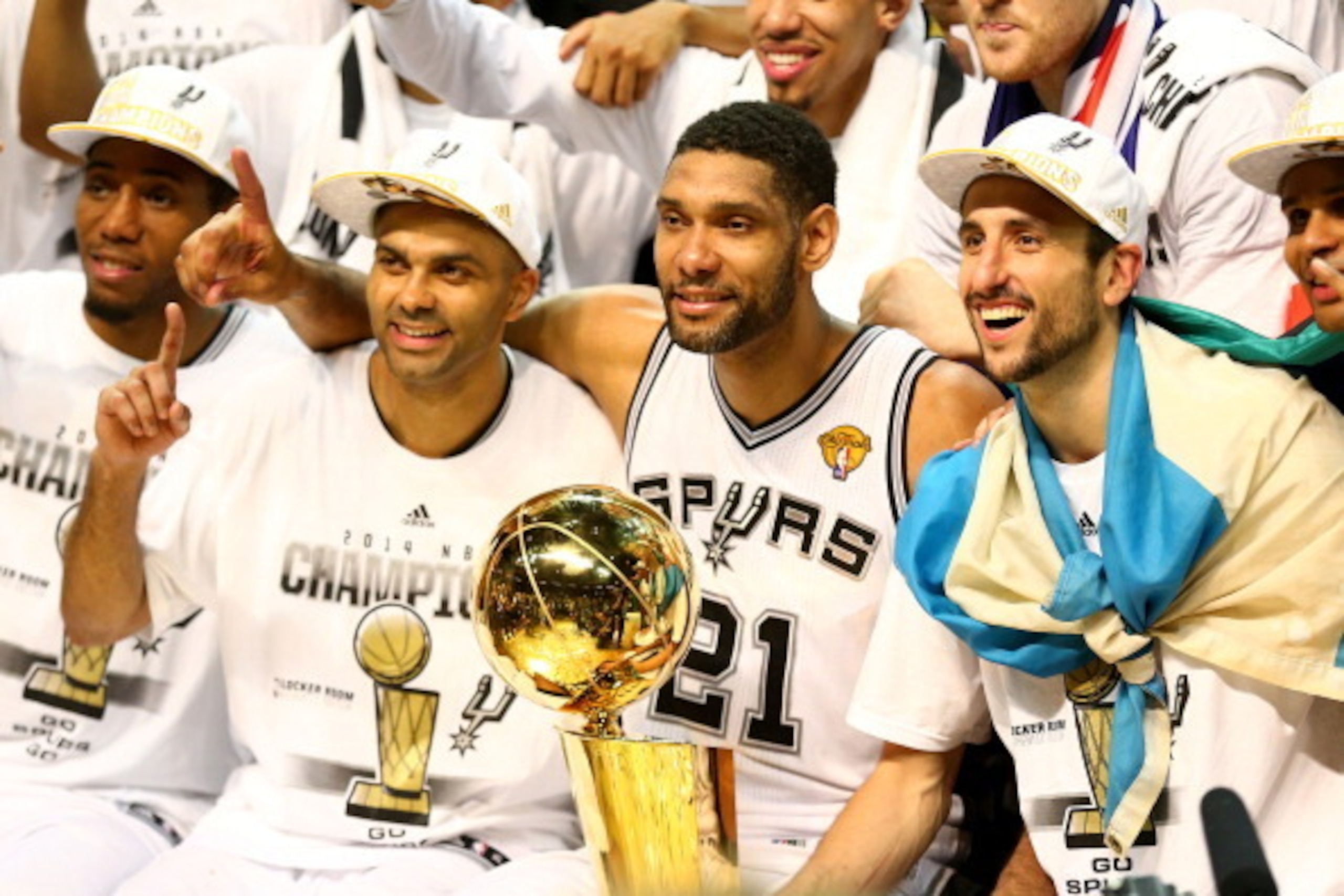 SAN ANTONIO, TX - JUNE 15:  Tony Parker #9 and Tim Duncan #21, and Manu Ginobili #20 of the San Antonio Spurs celebrate after defeating the Miami Heat in Game Five of the 2014 NBA Finals at the AT&T Center on June 15, 2014 in San Antonio, Texas. NOTE TO U