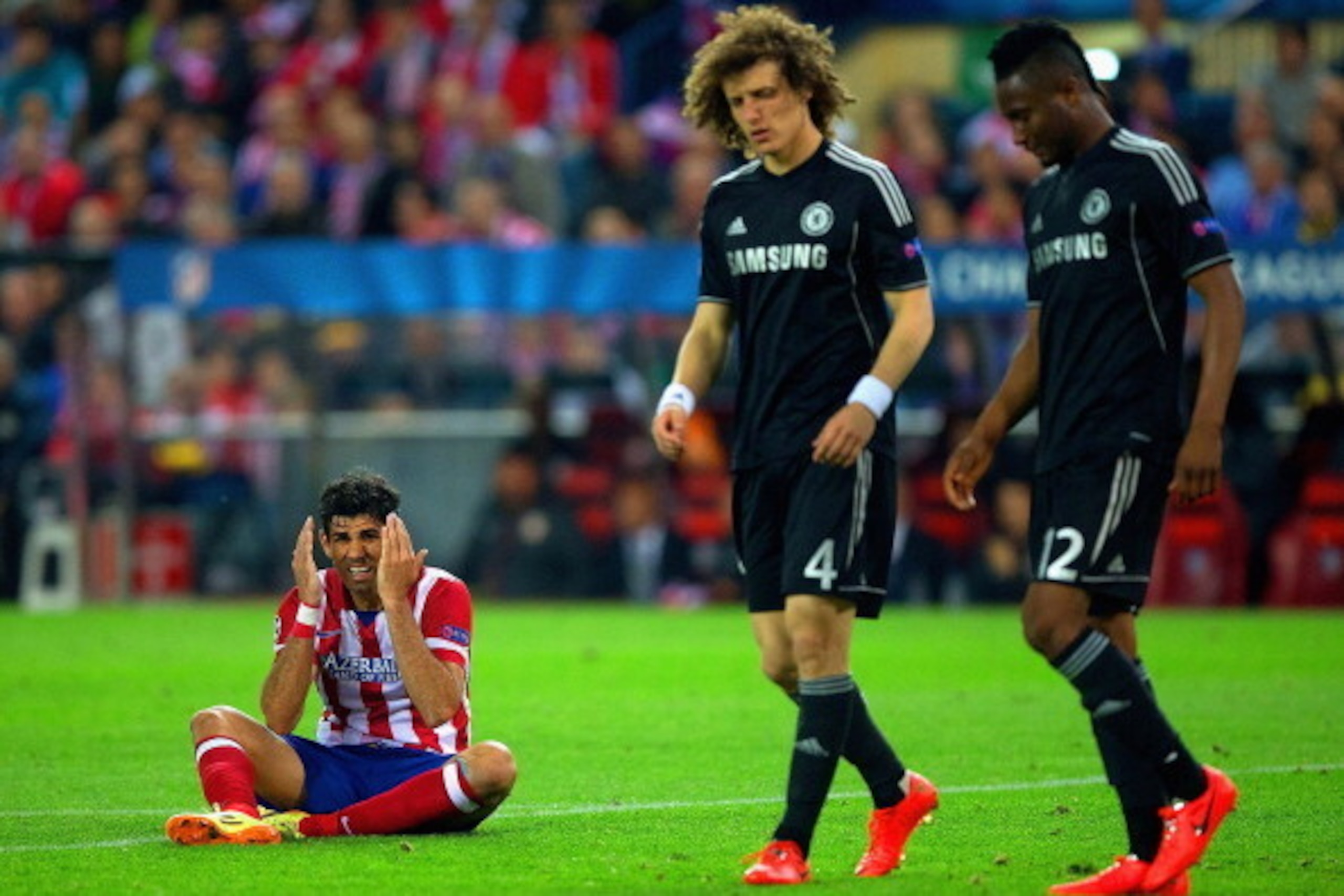 MADRID, SPAIN - APRIL 22: Diego Costa of Club Atletico de Madrid reacts as David Luiz and John Obi Mikel of Chelsea look on during the UEFA Champions League Semi Final first leg match between Club Atletico de Madrid and Chelsea at Vicente Calderon Stadiu MADRID, SPAIN - APRIL 22: Diego Costa of Club Atletico de Madrid reacts as David Luiz and John Obi Mikel of Chelsea look on during the UEFA Champions League Semi Final first leg match between Club Atletico de Madrid and Chelsea at Vicente Calderon Stadiu